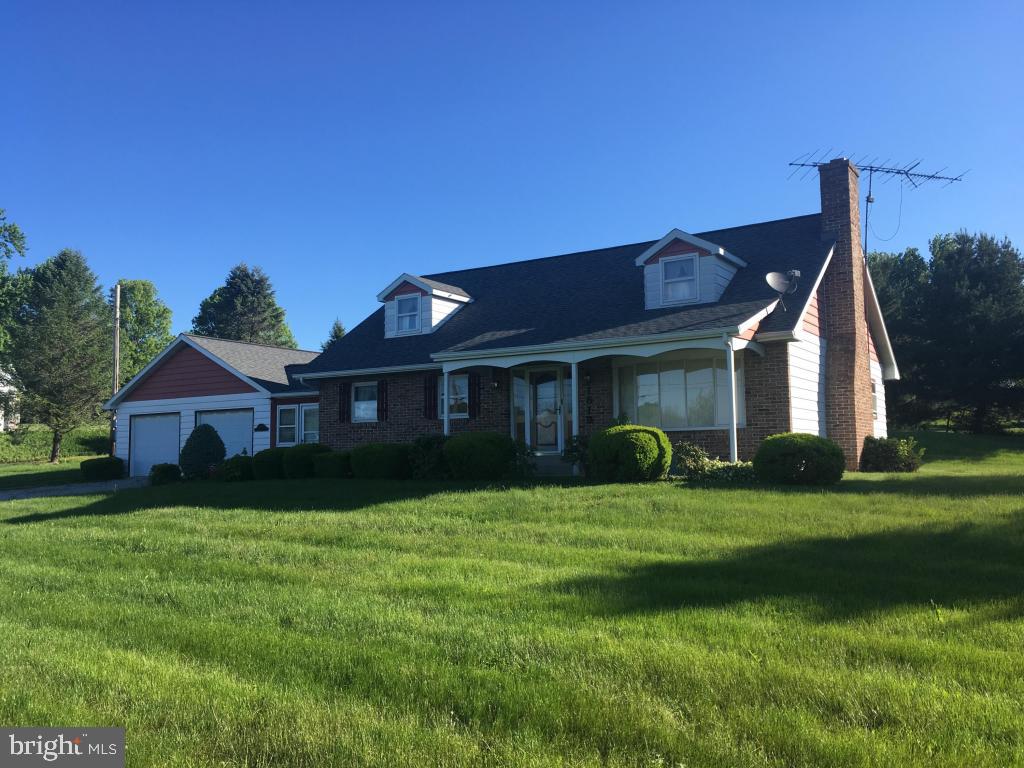 Super location 2 miles W of Rt. 222, 5 bedroom Warwick Twp home on .52 AC corner lot. 1 full & 2 1/2 baths. Nice kitchen w/ breakfast bar. Full basement. Finished FR w/ huge brick FP. Nice shop/work bench. Partially finished laundry. 1/2 bath. Over-sized 2 car garage. Elec. heat over 2600 sq. ft. finished floor space. Bring your ideas.