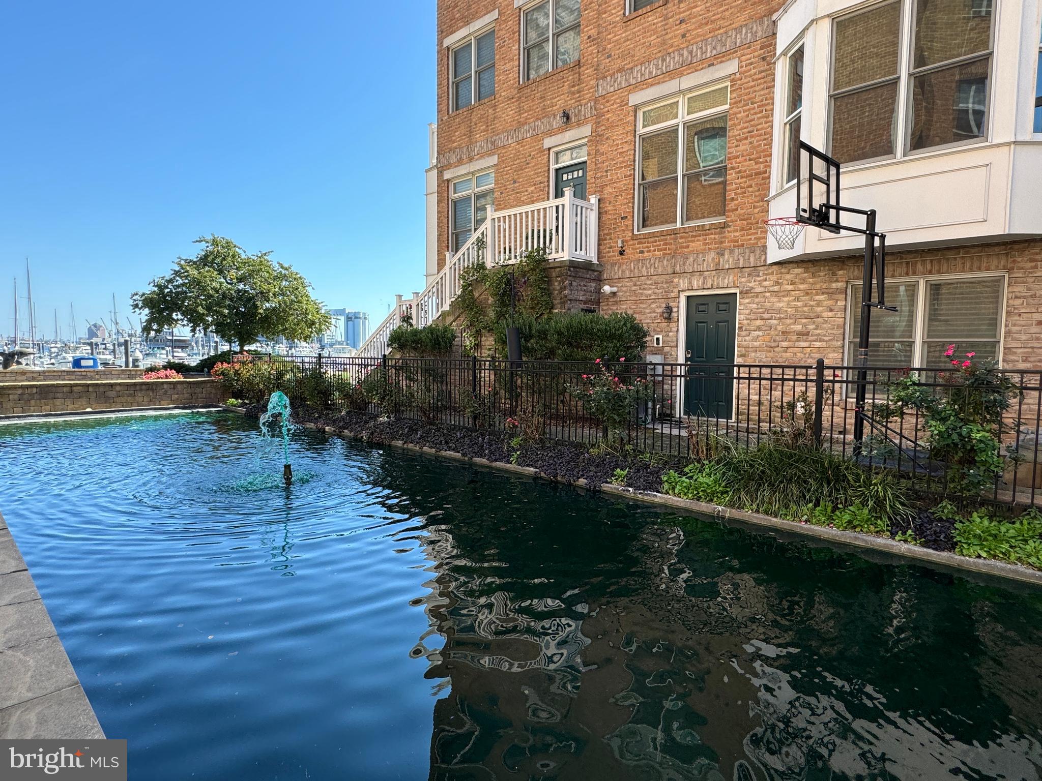 THE ABSOLUTE BEST DEAL in this building! Now is your chance to live the vacation lifestyle ALL YEAR! I mean... WHY NOT?! You deserve it! Welcome to the waterfront at 23 Pierside Dr, Unit #303 in Historic Federal Hill! Once through the secured entry and gorgeous lobby, the elevator will take you up to this one-bedroom, one-bath condo that offers a perfect blend of comfort, upgrades, convenience, and vibrant community living. The building is just steps away from the neighborhood's renowned restaurants, coffee and pastry shops, sports and concert venues, boutiques, and nightlife, making every day an adventure! This well-designed layout touts a spacious living area with beautiful wood flooring and lots of natural light. The fully equipped kitchen boasts granite countertops, ample cabinet space and separate washer and dryer. The large bedroom features plenty of closet space and a gorgeous attached bathroom. Stay fit and active with exclusive access to the on-site gym and enjoy the outdoor pool on hot summer days. Your safety is a top priority with secure building access, 24-hour concierge service and community security providing peace of mind. This unit comes with one assigned parking space. Don't miss the chance to make this condo yours! Schedule a showing today and discover the unmatched lifestyle that this location and ALL of Federal Hill has to offer!