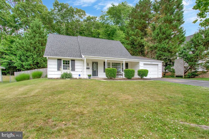 Welcome home to the beautifully maintained Cape Cod tucked away in the quiet I section of Bowie.  Brand new HVAC just installed.  2022 newly installed, roof, gutters, gutter guards, and hot water heater.  You are greeted by a large gorgeous driveway, 1 car garage, and an inviting covered porch.   The home's first level has 2 bedrooms, 1 full bath, living room, kitchen with corian countertops, dining area,  and walk out to deck, and  laundry/mud room, leading to one car garage.  Kitchen w/ stainless steel appliances with brand new refrigerator, breakfast bar, dining area, beautiful cherry wood floors throughout, and  lots of closets.  The upper level has an owners suite, full bath, and 4th bedroom.  On an oversized  lot that backs  to woods is perfect  for entertaining and  privacy.   Fenced in backyard w/ deck that backs up to open space w/ small stream, very scenic.   Close to major roads, shopping, schools, parks & more.  Shows well, Sold is AS-IS condition.