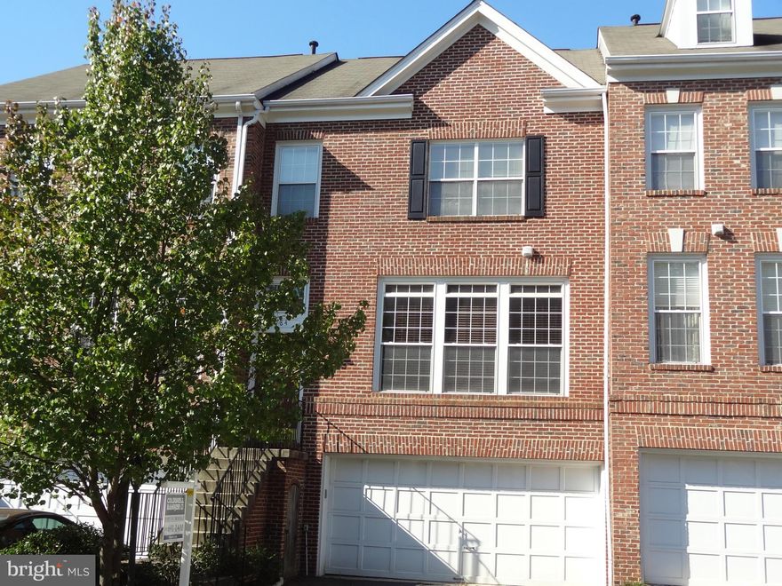 Spacious Brick 2-car Garage TH in Popular Windsor Mews - So Close to Retail and Commuter Options! ML Hardwoods, 9' ceilings, Gas Fplc, Lots of  Windows, Separate DR & Tiled Eat-in Kitchen! Sun Deck & Fenced Yard w/Brick Patio Backs to Trees! Big MBR with W/I Closet & BA:Dbl Sinks, Sep Soaking Tub & Shower! Rare Dbl Sinks in Hall BA! UL Laundry! Fin W/O Rec Room & Garage Access! Available Now.
