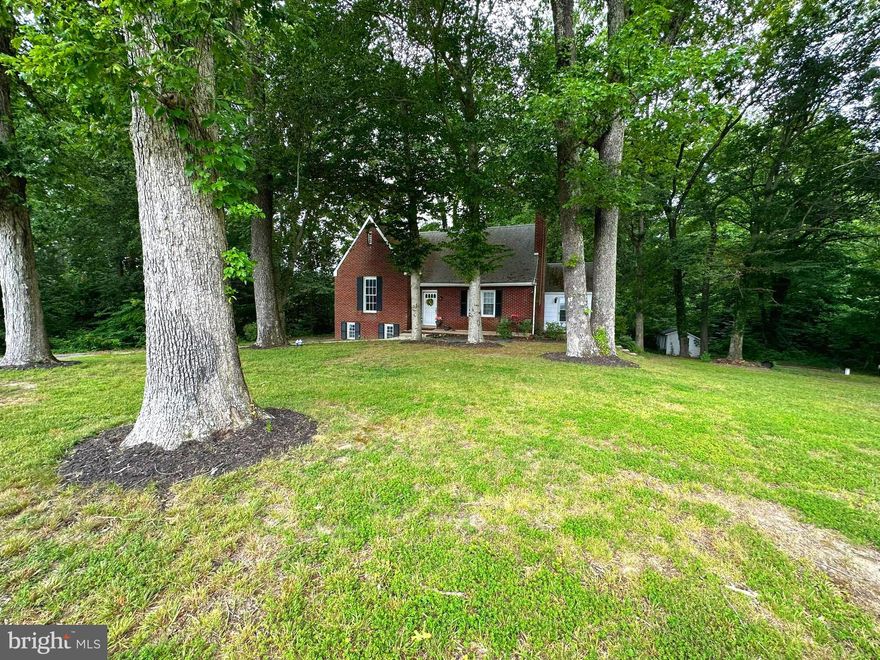 Diamond in the Rough.  This cute cape has so much character and potential. NO HOA.  Hardwood floors, fireplace, retro, galley kitchen, unfinished basement, new mini splits, large, shaded lot, circular driveway, garage, chicken coop/shed. Charming tri-level living space with unfinished (gutted) basement for room to grow.  Price reflects repairs needed.  Current owners in process of moving. The overgrown large area to the right of driveway is part of this lot and great space for detached additional garage.
