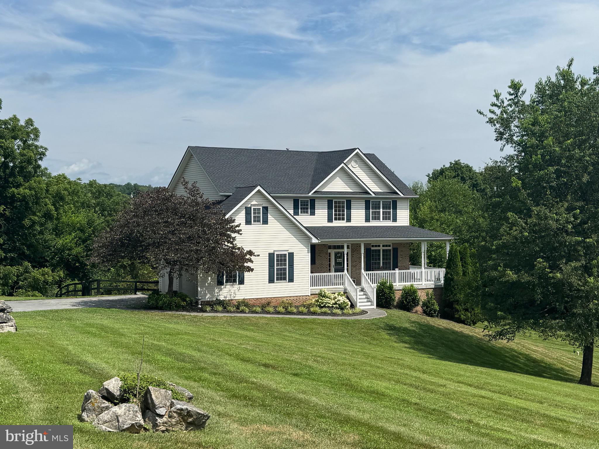 Fantastic Opportunity – One-Owner Country Charmer! Don’t miss this great opportunity to own a beautifully two-story home on a landscaped 1.26-acre lot, conveniently located near shopping and I-81. This spacious home offers 4 bedrooms and 2.5 bathrooms. The sunny kitchen features an island bar, solid surface countertops, and double ovens—perfect for cooking and gathering. It opens to a large family room with a cozy corner gas fireplace, ideal for relaxing evenings. You’ll also find formal living and dining rooms. Nine-foot ceilings throughout the main level create a bright, open feel, complemented by real oak hardwood floors that add warmth and charm. Enjoy morning coffee covered front porch or entertain outdoors on the covered rear deck. The home includes a two-car sideload garage and a full, unfinished walkout basement offering tons of storage or future expansion potential. Recent updates in 2024 include a new roof, a new furnace, a new tankless water heater, a remodeled front porch, and a fully renovated primary bathroom. With solid bones, recent improvements, and classic style, this home just needs a little TLC to become your dream home! Don't wait get your showing today!