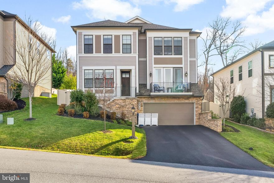 Modern Comfort Meets Lakeside Living in Lake Linganore

Step into this stunning contemporary home and instantly feel the warmth of its bright, open foyer. Gleaming hardwood floors flow throughout all levels, setting the tone for stylish yet comfortable living. Work-from-home days are elevated with a private office space perfectly suited for productivity and stunning views!

The heart of the home is the expansive family room, featuring a breathtaking floor-to-ceiling stone fireplace—an inviting centerpiece for cozy winter nights. A separate dining room provides the ideal setting for holiday gatherings and el fresco or stylish dinner parties. Step outside onto the elevated deck for the most stunning sunset views while you take in the evening air!

The large, open kitchen is designed for cooks and entertainers alike, offering ample cabinetry, upgraded countertops, stainless steel appliances, and a spacious island perfect for hosting.  The custom backsplash brings a sense of European charm to the kitchen! A charming coffee bar/butler’s pantry seamlessly connects the kitchen to the dining room, while the bright breakfast room delivers the perfect spot to start your mornings. Just off the breakfast room, step out onto the peaceful porch—ideal for enjoying quiet sunrises, sipping coffee, or a cookout with friends and family!

Upstairs, the primary suite is a serene retreat complete with a tray ceiling and a spa-inspired bathroom featuring a relaxing soaking tub, double vanity with storage, and thoughtful finishes throughout. Three additional bedrooms and two full bathrooms provide plenty of space for family or guests, and the oversized laundry room ensures effortless convenience.

The lower level offers endless possibilities—whether you envision a game room, playroom, or home theater. With an additional full bathroom and abundant storage, this space is ready for whatever you need. The unfinished space has an egress window so you could add another bedroom to the home quite easily!  The large fenced-in yard offers room to play, garden, or simply unwind.

Located in the desirable Lake Linganore community, you’ll enjoy access to beaches, pools, trails, lakes, sports courts, and all the resort-style amenities this sought-after neighborhood is known for. From this perfect location it is just a short walk to the dam wall and lake trail.  All of this close to the historic and award winning town of New Market and the city of Frederick!