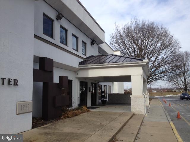 Flex use facility featuring Event Ballroom & fixtured commercl kitch, gymnasium, cafe, lobby&lounge, locker rms, & lrg classrms. 8.9ac: swimg pool, tennis cts, basebll field, covered pavilion, playgrnd & green field. Central air, handicap acs, heat & smoke sensors throughout. ALL FURNISHINGS, KITCH EQUIP & BALLRM AV INCLUDED IN SALE! Exposure to 22k cars/day! Zoned R2-prvs use Community Club under spl except.