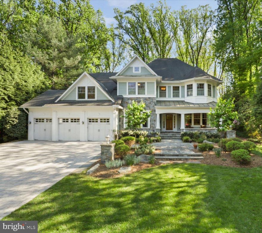 Situated on a beautifully landscaped half-acre in the heart of Franklin Park, McLean, 1889 Virginia Avenue is a custom-built residence offering over 7,600 square feet across four finished levels, with six bedrooms, seven and a half baths, four fireplaces, and an elevator shaft for future convenience. Built in 2011 with timeless architecture and enduring materials, this exceptional home blends classic elegance with modern livability.

A gracious foyer welcomes you into a thoughtfully composed interior defined by rich hardwood floors, refined millwork, and expansive windows that flood the home with natural light. The formal living room exudes understated sophistication—an inviting space for conversation or evening cocktails served from the butler’s pantry—while the elegant dining room is perfectly scaled for intimate dinners or larger holiday gatherings. A private library provides a quiet retreat, ideal for working from home or enjoying a good book.

Designed for effortless entertaining and daily comfort, the well-appointed kitchen features premium appliances, custom cabinetry, an oversized island, and a walk-in pantry. The generous breakfast area flows seamlessly into the family room, where built-ins and a statement fireplace anchor the space. French doors from the dining room, kitchen, and sunroom provide direct access to the flagstone patio and landscaped yard, creating a seamless indoor-outdoor connection. The light-filled sunroom, with its spectacular views, is a particularly special space. The impressive mudroom, complete with a full refrigerator, additional cabinetry, and closets leads to the three-car garage and expansive driveway, combining convenience with presence.

Upstairs, the primary suite features a spa-inspired bath with heated tile floors and dual walk-in closets. A sitting area with a coffee bar opens to a balcony overlooking the rear garden. Spacious secondary bedrooms, each with en suite baths and generous walk-in closets, offer comfort and privacy. A bonus fourth-level loft with a full bath provides flexibility as an art studio or teen lounge. The fully finished daylight lower level is designed for recreation and relaxation, featuring a large entertaining area, fitness space, additional bedroom suite, and abundant storage.

Ideally located just minutes from downtown McLean, Tysons, and Washington, DC, this distinguished Franklin Park residence offers exceptional scale, craftsmanship, and enduring appeal in one of Northern Virginia’s most sought-after communities.