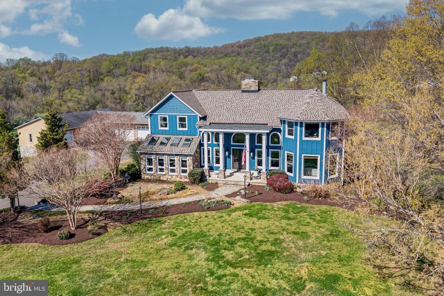 The impressive timber-framed, custom home has complete privacy and stunning views from every direction.  With almost 6,500 sq ft of living space, the main level offers a great room with a floor to ceiling stone fireplace, inviting living room, sunken conservatory, gourmet kitchen with Viking appliances and breakfast room, separate dining room with another stone fireplace, and the ability to have a main floor suite.  The upper level has a primary suite with another wood-burning fireplace and expansive views, a loft/office space, and 2 additional bedrooms.  Floors were completely refinished in 2026, offering a nice combination of pine, cherry, and oak throughout.  Lower level has a separate entrance, media room, and ample storage.  Grounds include a pool with a waterfall, porches, gardens, and a charming pavilion with firepit.  Separate 5-car garage has large doors, lift, and shop area.  Fenced fields, and separate 4-bay machine shed create an ideal opportunity to have a small farm or enjoy complete serenity.  New roof 2022, new Hardie Plank siding in 2023, and other improvements upon request.   Starlink internet installed.  Seller is not responsible for roll-back taxes.