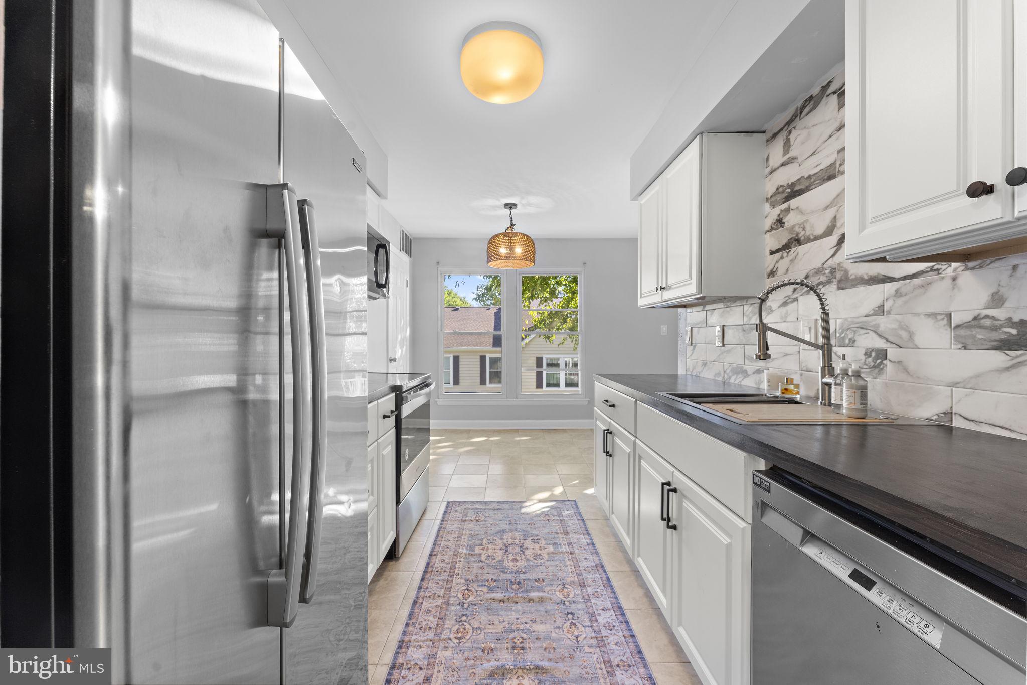 Welcome to 20172 Locustdale Dr #221. Fully renovated and move-in ready. 2025 updates include fresh interior paint, new flooring throughout, and a brand-new kitchen with new cabinets and countertops, and a full stainless steel appliance package. Both bathrooms were completely redone with clean, modern finishes. The bright, open main level offers flexible living and dining space and opens to a new deck for easy indoor-outdoor living. You'll find two well-sized bedrooms, ample closet space, and a private bath for the main bedroom. Convenient Germantown location with quick access to I-270, MARC, shopping, dining, parks, and trails. Turnkey and easy to show.