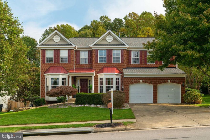 Welcome Home to this stately Brick Front Colonial located in the Beautiful Neighborhood of Wayside Village/Southbridge! With over 4500 finished square feet, this home offers Hardwood Flooring,  Formal Living and Dining Rooms, Main Level Office, Central Family Room with Soaring Two Story Ceiling, Gas Fireplace with Stone to Ceiling Front, Kitchen with Island, Breakfast Bar, Under Cabinet Lighting, Pantry and desk, and a Sun Filled  Morning Room located just off the kitchen with French Doors Leading to the Deck.  The Upper level Hallway has an Arched walkway overlooking the Family Room, the Owner's Bedroom offers a Vaulted Ceiling, Huge Walk In Closet and a Luxury Bathroom with a Separate Shower and Soaking Tub. Bedrooms 2-4 are Large and each with a walk in Closet, plus Upper Level Laundry. The Lower Level offers a Walk Up with Double French Doors, a Cozy Family/Rec Room, Extra Den/Office /Theater Room with Walk In Closet, a Full Bathroom and Large Storage Area. The Back Deck overlooks the Treed Common area and Level Back Yard. Other features include: Newer Roof & Water Heater, Sprinkler System, Ceiling Fans, Washer/Dryer and More! Conveniently located just minutes from I95, Commuter Lot and Busses.