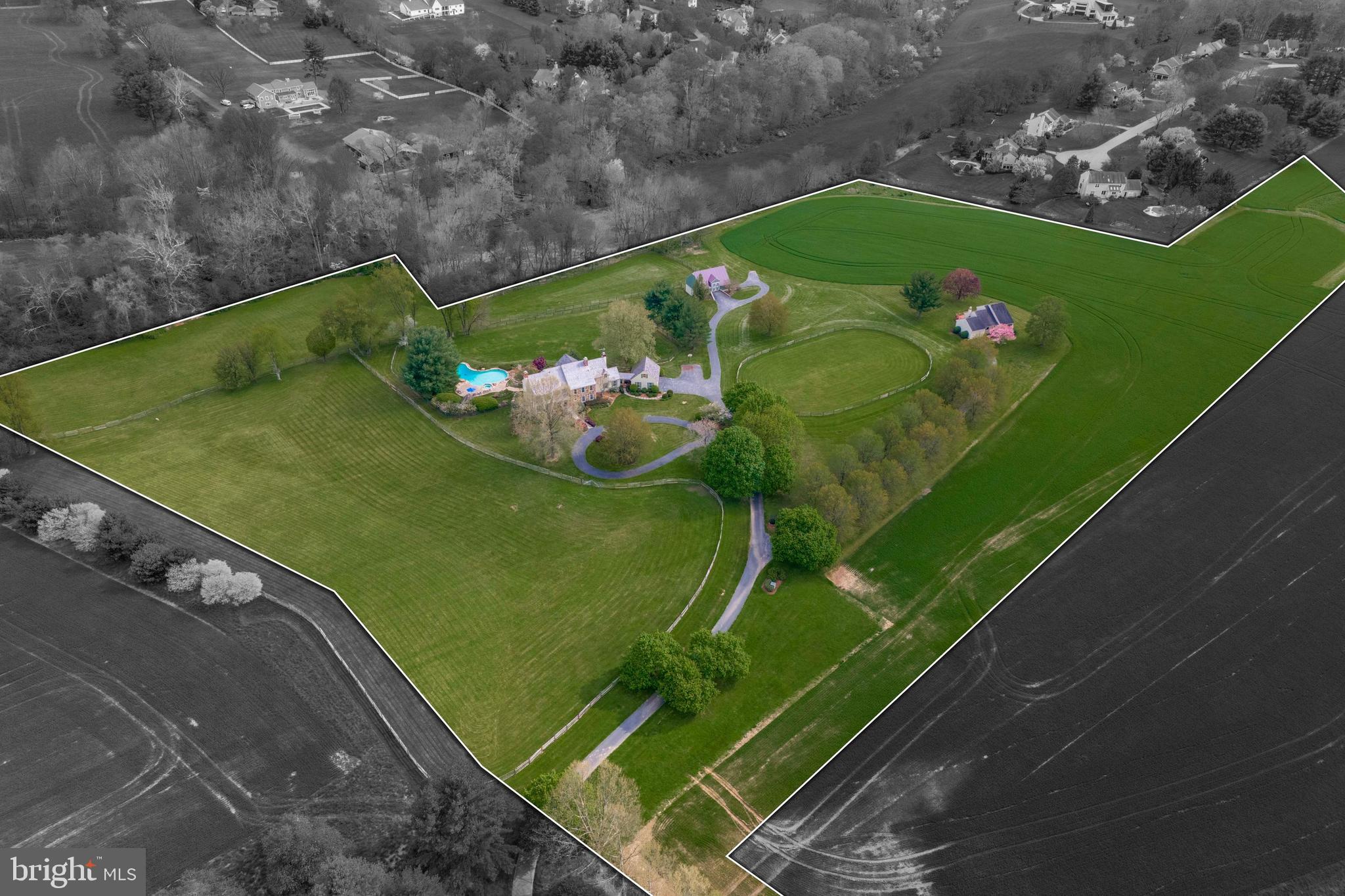 Your once in a lifetime opportunity to own the prestigious Windy Knoll Farm is here! A true oasis in the award-winning Unionville-Chadds Ford School district that sits at the highpoint of 20 acres of land, featuring 360-degree views of sweeping pastures, a fully equipped barn with horse stables and two separate residences. As you make your way over the bridge and up the serene path you will approach the circle driveway that sits just outside the estate-like primary residence. When you enter the stately main house you will be greeted by pristine hardwood floors and detailed molding that carry throughout most of the main level. The cozy living room features a stunning wood-burning fireplace and custom built-ins. Flow effortlessly through the bright dining room, with an oversized bay window, into the eat-in kitchen equipped with a double wall oven and stainless steel appliances. Just off the kitchen you will find your sun drenched family room that lends access to your patio, a separate walk-off porch, and the den (currently used as a rec room) with a stone, wood-burning fireplace and detailed arched cabinetry and shelving. On this main level you will also find your laundry room, two powder rooms, and another dignified family room with a wood-burning fireplace and built-in shelving perfect for an office. There is both a formal front stairway and a back staircase leading you to the second story. On this level you will find your massive primary bedroom with double closets, a large window seat, and a full en suite bath equipped with a spa-like jacuzzi soaking tub and glass-stall shower. Four other sizable bedrooms and a full hall bath with soaking tub and glass stall shower are also located on this level. As well as access to your large walk-up attic with a plethora of storage space. The southern side of the house captures breathtaking views of the pastures and tree-lined landscape beyond. The full, unfinished basement is the perfect canvas to add additional finished living space or for all of your storage or workshop needs. The garage is located just off the mudroom/drop zone area and adjacent to the second half bath on the eastern side of the main level, perfect for cleaning up after spending time outdoors. Outside, find your truly private oasis offering a large freeform heated pool with a hot tub and pergola that overlooks the large fenced in backyard, an entertainer's paradise! The guest house on the property is perfect for separate in-law living quarters or can serve as an income producing rental property. This 3 bed, 2 bath move-in ready single family guest house offers open concept living, with high vaulted ceilings, stainless steel appliances, laundry, its own attached garage, as well as a walk-off deck overlooking lush land and pasture.
This estate is the true equestrian's dream with a large, fully equipped barn housing a heated tack room, four stalls, a wash-stall with hot water, french drains, plus two pastures, paddock with water, and a riding rink. This oasis is conveniently located with easy access to West Chester, Unionville, Kennett Square, Wilmington, and Philadelphia. Schedule your private tour today! For those of you who have been searching for a quintessential Chester County estate, this home is a once in a lifetime, forever home opportunity that you do not want to miss!