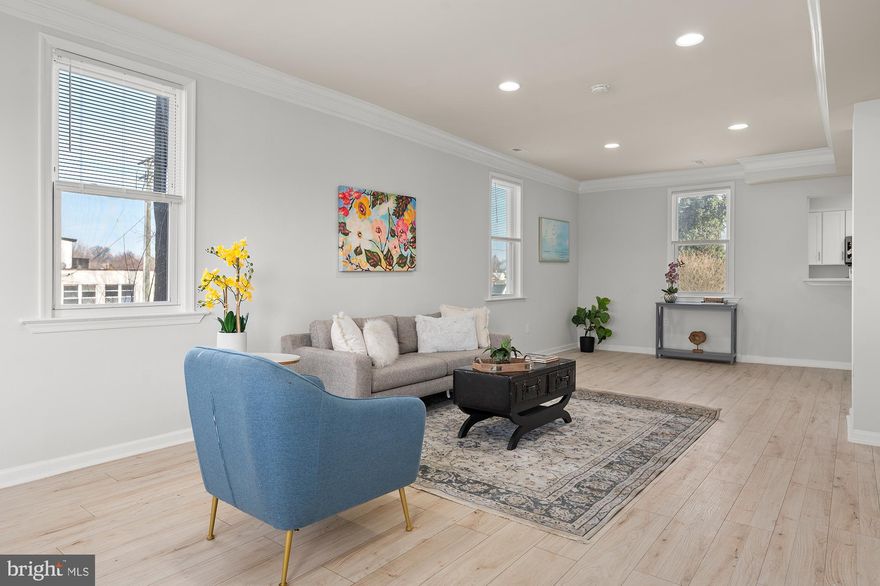 Discover the perfect blend of charm and modern convenience in this beautifully renovated Victorian home offering over 2,500 sq. ft. of living space. Step inside to an open floor plan featuring a living room with elegant crown molding, a separate dining area, and a welcoming entry sunroom filled with natural light. The updated kitchen boasts granite countertops, stainless steel appliances, and ample cabinet space. A main-level laundry area and half bath add extra convenience.  Upstairs, the spacious Primary Suite impresses with a large walk-in closet and a luxurious full bath. Three additional bedrooms and another full bath provide plenty of space for family or guests. The finished basement offers endless possibilities for recreation, a home office, or extra storage.  Enjoy outdoor living in the large rear yard, perfect for gatherings, gardening, or relaxation. This home combines timeless character with modern updates—don't miss your chance to make it yours!  Property is zoned C-1 - buyer to verify specific use for zoning