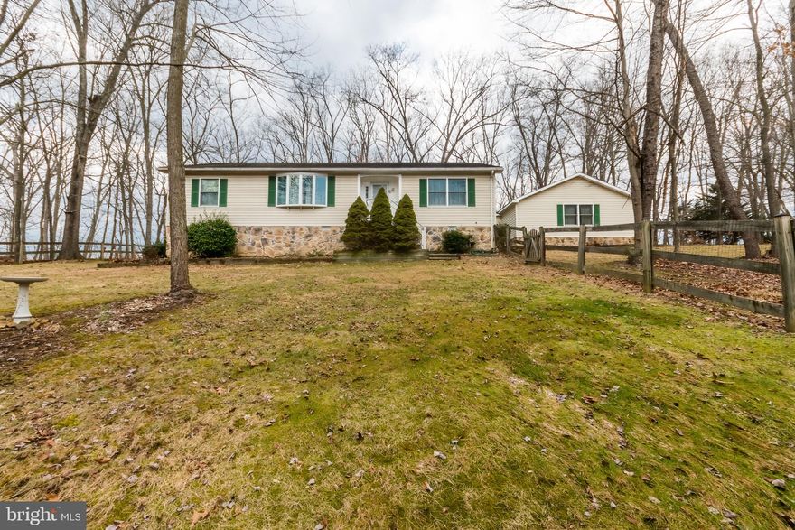 This lovely home is a traditional style rancher with 3br,2ba, den, formal dining, large living room, eat in kitchen, and laundry room. The primary bedroom has  full bath. The formal dining room has large double window and the den has a large bay window each facing the front of the home with the mountain views. There is also a large front foyer entrance.  The rear main entrance comes into the mud room next to the oversized heated attached 2 car garage all on 2.13 acres. Home has a fenced yard and fantastic views of the Sleepy Creek Mountain.  Home has a circular driveway and a large storage shed. This home is located in Hillcrest SD but the driveway and access is off of Winstead Rd.  An absolute great location just outside of Historic Berkeley Springs and all the amenities of the area. This ready to move in property includes a one year Home Warranty. Home has well and septic and a home water treatment system. Home has raised front and sits on a crawl space.