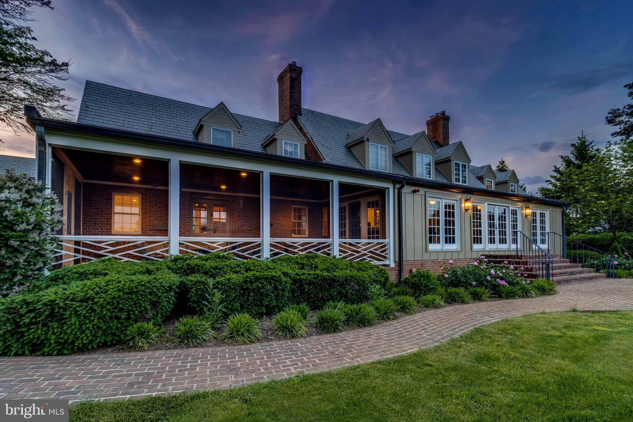 Live authentically. Glorious 50 acre farm. Timeless brick Tidewater estate in the heart of My Lady's Manor. Relish the long tree-lined drive and sense of arrival. Georgian classic proportions throughout. Inviting screened in porch made for living. Glass runs the entire length of the house for sublime views all year round. Bring the outside in. Sparkling pool and generous outdoor living spaces to enjoy every last minute of the summer sunsets overlooking the epic vistas in the distance that are yours. Seven stall barn and riding ring, equipment building. Tenant house has three bedrooms and one bathroom for hosting short or long-term guests. Prime Elkridge-Harford locale. Zippy access to Manor Tavern, Inverness Brewery, and Ladew Gardens. See 16425 Old York Rd listing. This property can be purchased with 10.45 acres at $1,700,000, or with additional non-density pasture 39.55 acres for $1,950,000. Property cannot be subdivided. No main dwelling is permitted on the 39.55 acres. The art of uniting human and home.