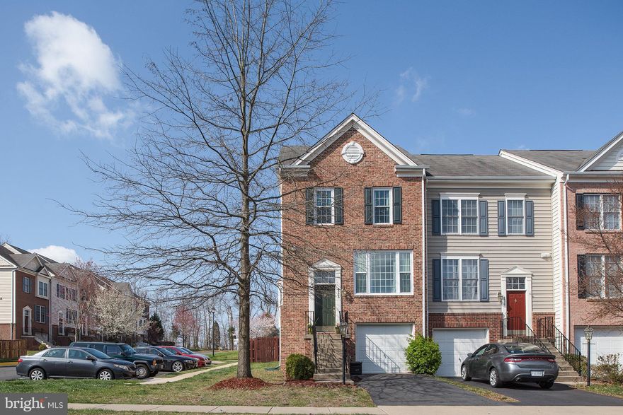 Spacious and bright! This brick front end unit TH in the sought after Compton Farm community has it all including 3 level bump-out, Master bedroom sitting room and basement level den.Gorgeous Bay window fills breakfast area and kitchen with tons of light.Master bath features huge tub with sep shower and double sinks. NEW Triple Pane Windows, Kitchen Tile and Main level Hardwoods all done in 2017.