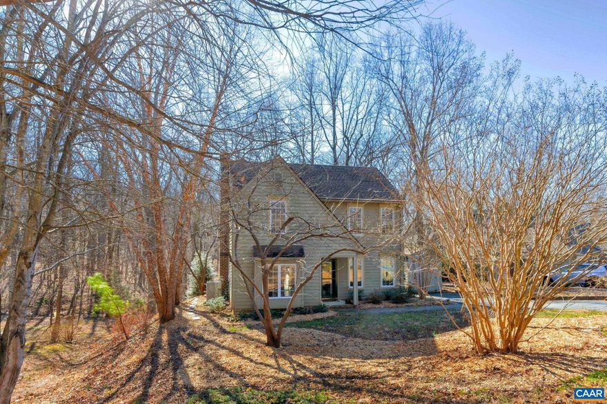 You will be delighted by the careful attention to detail in the upgrades and renovations of this thoughtfully-maintained and much-loved home. Custom built kitchen cabinets maximize storage space to keep counters clear, gorgeous tile floor in kitchen reflects afternoon light, renovated master bath with full walk in shower, three shower heads, and river stones, heated marble floor and custom-built double vanities. Solar panels reduce electric bills and natural gas fuels kitchen stove, outdoor grill, and fire table. Watch the sun set over private backyard and woods from an expansive back deck with cable railings providing a clear view of the woods or enjoy watching birds and wildlife while you?re tucked inside by the gas fireplace. Just steps away from Biscuit Run park and less than a 10 minute drive to the services and stores at Fifth Street Station and the Downtown Mall. Environmentally-friendly upgrades include solar power (including annual returns on solar renewable energy credits), high efficiency HVAC with smart thermostat, and tankless hot water heater for an endless supply of hot water throughout the house. High speed fiber internet, easy access to nature, and a quick drive to the best Charlottesville has to offer.,Granite Counter,White Cabinets,Fireplace in Living Room