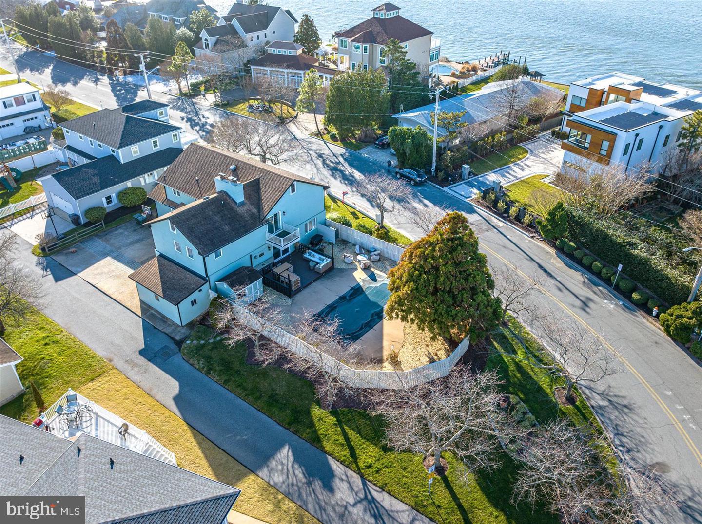 Don't miss this incredible opportunity to own your dream home on Mallard Island! Mallard Island is the best kept secret of Ocean City and one of the most sought-after custom home communities in OC. The island has only 42 homes which rarely come on the market. If you miss this one, you could be waiting years for another opportunity to be part of this amazing family-oriented community. This beautifully updated 5-bedroom, 4-bathroom home sits on a double lot, with the potential to subdivide (verify with Planning & Zoning). The private backyard is a relaxing oasis featuring a low-maintenance deck with kitchenette, a beautiful in-ground pool, a gas firepit, and tons of space for entertaining. The exterior is professionally maintained and boasts clean and modern accents, including a spacious covered front porch with a stylish steel entry door, exterior lighting, and a new front porch railing. Essential updates include a new oil tank, hot water heater, oil burner, and pool pump. In addition, a new patio door and two brand new high-efficiency HVAC systems (including ductwork were installed April 2025.
Step inside and be wowed by this luxuious space! Over 4700 sf of living space with a variety of unique spaces to unwind and enjoy the easy living vibes of Ocean City. The main level features a bright and airy living room/dining room combination, all freshly painted with new lighting and blinds throughout, along with a fire place in the living room on the main level and a fireplace in upstairs gameroom/master! The kitchen shines with stainless steel appliances, granite countertops, and a stylish backsplash. A brand-new washer and dryer are also conveniently located on the main level as well as a large bedroom. The bathrooms have all been remodeled and tastefully decorated. Upstairs, you'll find the ultimate game room, with a wet bar, fireplace, and pinball machines for added fun. Both sliding doors will be replaced and primary bedroom ceiling after Labor Day weekend. The game room can also be configured as a large primary bedroom suite. The upper level also includes an in-law suite with a separate entrance for privacy. The home is complete with a spacious two-car garage plus an additional side garage—perfect for storing beach toys, bikes, and more. A large private driveway provides ample space for multiple vehicles and easy guest access. This home is being delivered FULLY FURNISHED (as seen in photos) and a Pinterest dream! Don't let this rare Mallard Island gem slip away—schedule your showing today!