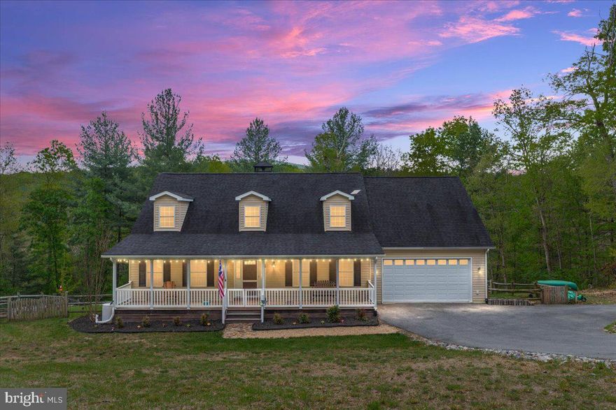 Welcome to your private woodland retreat at 220 Deerhaven Road. Set on 5.41 wooded acres in scenic Front Royal, this charming Cape Cod combines timeless style with peaceful natural surroundings, including a beautiful stream flowing through the property.<br><br>

The home features hardwood & LVP flooring, a stunning stone fireplace complete with a wood stove, spacious living areas, and a thoughtfully designed kitchen with granite countertops, stainless steel appliances, and generous cabinet space. The sought-after main-level primary suite includes a private ensuite bath, while the upper level offers two additional bedrooms connected by a Jack and Jill bathroom.<br><br>

The finished lower level adds exceptional versatility to the home, featuring a large game room as well as a  hobby room complete with its own full bathroom and utility sink, ideal for crafts, projects, creative pursuits, or guest accommodations. A flexible walkout space offers endless possibilities as a mudroom, home office, exercise area, or additional sitting room. The unfinished section of the basement provides abundant workshop and storage space for tools, equipment, hobbies, or future expansion opportunities.<br><br>

Outdoor living shines with both a classic covered front porch and a screened rear porch overlooking the peaceful wooded surroundings. With privacy, mature trees, and convenient access to shopping, dining, recreation, and commuter routes, this property offers the ideal balance of seclusion and accessibility in the heart of Front Royal.