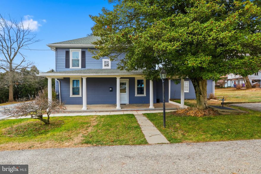 Step into timeless charm paired with thoughtful updates in this meticulously maintained 1800s home, where historic character meets modern improvements. The seller has invested heavily in the structural, mechanical, and exterior components of the property, providing peace of mind for the next owner. The home features original chestnut trim, doors, stair railings, and stained glass details that beautifully preserve its historic appeal. Solid oak hardwood floors, ¾” subflooring, and reinforced load-bearing support contribute to a strong and sturdy feel throughout the main living areas. Brand-new ceilings were installed in the living room and foyer, enhancing both comfort and presentation. The exterior was painted four years ago, and the architectural-shingle roof is just four years old, including both sheds. A brand-new pitched concrete sidewalk surrounds the home, thoughtfully designed to direct water away from the foundation. Additional exterior highlights include a Bilco basement door, split-rail fencing marking the property line on one side (the lot extends over 220 feet deep from the front of the property to the rear, reaching the neighboring driveway), mature landscaping including a stunning Japanese maple, floodlighting, and a spacious 0.69-acre lot ideal for a future pole barn. Inside, the main level offers real hardwood floors, a formal living room, foyer, dining room, full bath, and kitchen. The kitchen includes original wood cabinetry, a new window, and washer/dryer hookups, with the option to relocate laundry to the basement. A vestibule connects the kitchen to an enclosed breezeway with metal shelving that conveys. The powder room off the dining room features ceramic tile, a new vanity, and a mirrored cabinet. Upstairs includes a full bathroom, all new double-hung windows, and a large bonus area off the bath that could easily be transformed into a walk-in closet, nursery, or sitting room. A brand-new vanity mirror and faucet are included, along with a complete shower kit to easily convert the tub into a full tub/shower combination. The walk-out basement has been completely transformed from its original dirt floor into a versatile space featuring concrete floors, framed front walls, multiple electrical outlets, new steps, and rough-ins for a future powder room. A toilet is already in place, making the addition of a basement powder room straightforward. The seller added structural reinforcement, installed a new sump pump with a backup, and prepared the space for multiple uses including a home office, workshop, wine cellar, or recreation area. A second washer/dryer hookup is already in place. Mechanical updates include a brand-new gas stove with convection oven, refrigerator, dishwasher, and hot water heater (October 2025), a 2016 furnace, a brand-new boiler, a new well pump (July 2024), and an ejector pit with the sewer line run above grade. Smoke and carbon monoxide detectors are installed throughout. The attic offers walk-up access, new flooring, additional insulation, and flexible space suitable for storage, a playroom, or hobby area. New blown-in insulation beneath the attic floor adds energy efficiency. Located minutes from the rail trail, Walmart, and a variety of shopping, with easy access to Maryland and nearby historic steam trains, this home offers a rare blend of character, care, and convenience. A truly special property where the heavy lifting has been done — ready for its next chapter. Professional photos being done and will be available on or before January 1