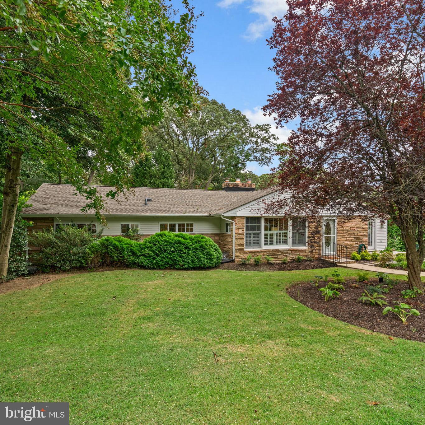 Welcome to 206 Pine Avenue in Cape Arthur, one of Severna Park’s most desirable waterfront communities. Step inside to a cozy living room with an oversized stone fireplace (natural gas), opening to a custom kitchen with granite countertops, stainless steel appliances, and plenty of cabinet space. The home also features a bright home office, a spacious great room addition with walls of windows and sliding doors, and two decks perfect for entertaining. The main level includes a primary suite with updated bath, two additional bedrooms, laundry, and a brand-new hall bathroom.
Downstairs, enjoy a game room with half bath and a large storage room. The standout feature is the amazing in-law/au pair suite—accessed through its own entrance or through the front coat closet, like stepping into Narnia! This private retreat includes two bedrooms, a living and dining area with gas fireplace, full bath, new mini-split for heating and cooling, its own deck, and updated bath, making it perfect for multigenerational living or an au pair.
The beautifully landscaped, flat backyard offers fruit trees (peach, fig, persimmon, and Maryland-native pawpaw) and multiple raised garden beds for your vegetables. In addition, there is an oversized custom 24x12 shed with electric and lighting. Major updates include: roof (2022), hot water heater (2025), hall bath (2025), mini-split (2020), basement flooring & paint (2025), refrigerator & microwave (2020).
Living in Cape Arthur means more than just a home—it’s a lifestyle. Residents enjoy one of the best private beaches in Severna Park with sandy swimming area, diving board, large pier, and boat slips (waitlist). The community also features a newly updated park, tennis and pickleball courts, sports fields, and countless events including annual crab feasts, tiki parties, garden club, ladies’ social club, Candy Cane Lane during the holidays, and so much more.