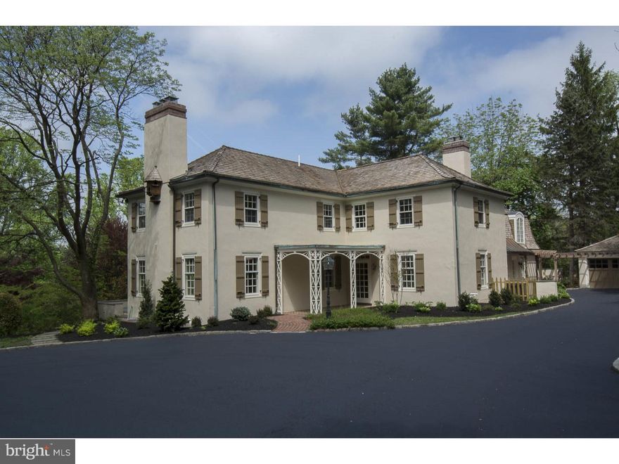 Enter through the gated entrance down the long, beautifully landscaped driveway and find this private, newly renovated French Colonial on 2 gorgeous acres equipped with a stream at the base of the property. This 5 bedroom, 4.2 bath home has been renovated to please the most discerning buyer, using only the finest materials and Rene Hoffman designs. Quality and attention to detail are evident throughout the entire home, with restored wide-width pegged floors, high ceilings and crown molding. The large Living Room and Dining room both provide french door access to the oversized patio which overlooks the private yard with views seldom found on the Main Line. Brand new Gourmet eat-in kitchen is equipped with DeRita custom cabinets, granite countertops, top of the line Thermador appliances and Butlers Pantry. Off of the kitchen you will find the large family room with custom built-ins, take a step down to the sunroom with 3 sided floor to ceiling windows which overlooks the rear and side yard. On this level you will also find a private office, mudroom/laundry room and formal powder room. Ascend the sweeping staircase to the second level where you will find the Master Suite with three-sided window exposures, marble fireplace, his/her large walk-in closets and dressing room. The brand new Master Bath is equipped with private toilet room, classic clawfoot tub, large marble tile shower with custom glass and seat, beautiful granite countertops, furniture style custom cabinetry and classic fixtures. 4 additional bedrooms and 3 full baths complete this level. This homes three finished levels, including the walk-out sunlit Lower Level with additional family room, powder room, workout/billiard room and walk-in wine cellar, provide ample space for family living and entertaining.