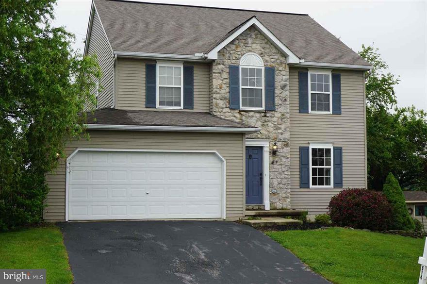 Beautiful 2420 sq ft 4 BR 2.5 bath home in Dallastown School Dist.  Open floor plan with 1st floor hdwd floors, stainless steel appliances, glass backsplash, spacious BRs, MBR has 2 w/in closets & vaulted ceiling, finished basement w/gas FP, french doors lead to cobblestone patio and private fenced yard.  New paint & carpet.  Tasteful inside and out.