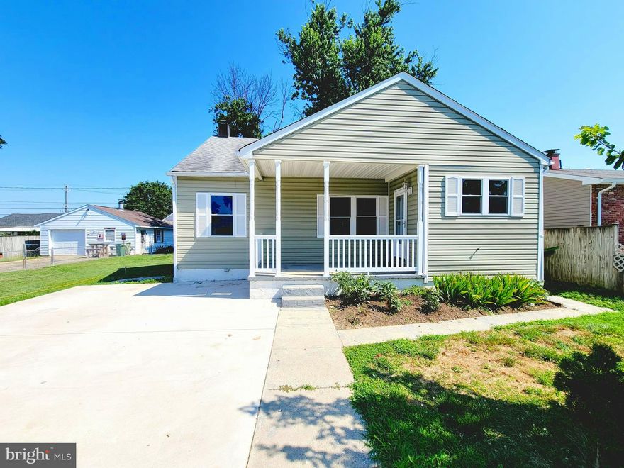 Beautifully Remodeled !!  This super cute front porch home will greet you with a brand new driveway that offers plenty of parking .  Inside features gleaming real hardwood floors, updated kitchen with granite, tile backsplash,  and stainless steel appliances.  The main level has 2 bedrooms and a full bath.  The finished basement offers a wet bar, 2 additional bedrooms, a full bath, and family room.  Nice backyard for entertaining!  Great location, convenient to 695 and 97.  Walking distance to park, shopping and school.  Schedule your appointment today!  AS IS