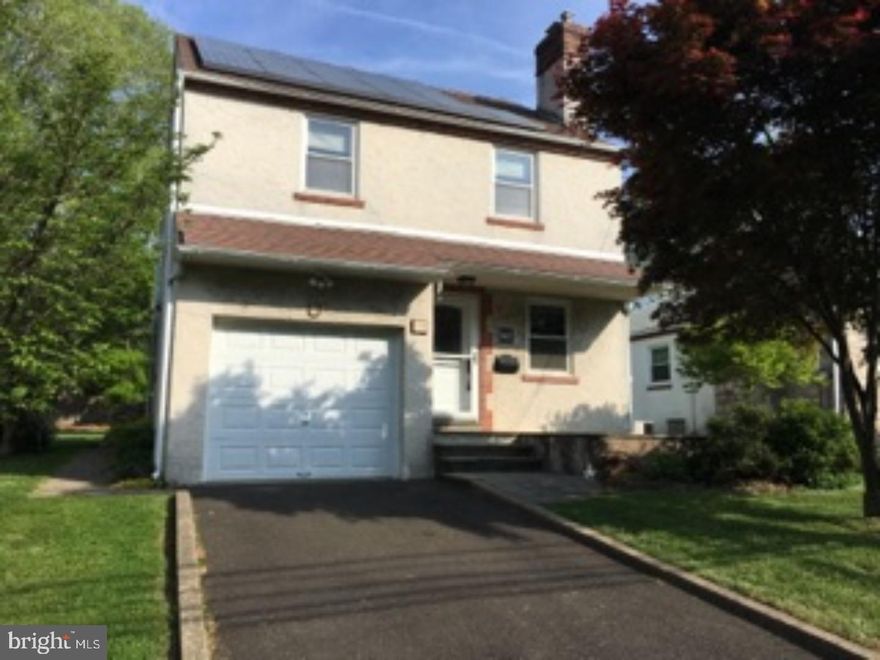 Hurry, won't last long.  4 bedroom Springfield Twp home close to everything.  Easy commute.  Updated kitchen, hardwood floors, Living Room with Fireplace, and Dining Room.  Upgrades include central air, heating system, Vivant solar panels with transferable contract, newer windows and doors, storage is easy with a basement and attached garage.  Large rear yard for entertaining.