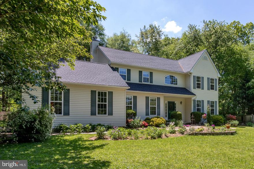 Welcome to your private nature preserve and sanctuary surrounded by mature hardwoods, flowering shrubs, a beautiful array of native and non-native perennials, not to mention welcoming butterflies, hummingbirds, and many species of birds throughout the year. This bright and airy home has been upgraded and extremely well maintained. The main floor has 9' ceilings throughout. A dramatic 2-story foyer flows to a formal living room and bright and spacious formal dining room, both with crown molding and fresh paint. Warm red oak hardwood flooring leads through the center hall to the heart of the house where the open floor plan includes a large family room, wonderfully upgraded kitchen, and breakfast nook, all looking out to the deck and peaceful backyard oasis. The custom kitchen has plenty of windows and fresh paint, Kraftmaid Durango Birch 42" cabinets with soft-close drawers, level 4 granite countertops, SS appliances, and both under and over cabinet lighting. Upstairs you'll find the primary bedroom suite and 3 large bedrooms, and downstairs the basement is finished with fresh paint and new carpeting. This home is truly move-in ready and shows it. A Lennox propane furnace, heat pump and humidification system was installed in 2016, the roof and deck were new in 2019, and a new hot water heater was installed this year. Great location and neighborhood close to Oxford and Rt 1 with easy drives to DE, MD and the Philadelphia area.