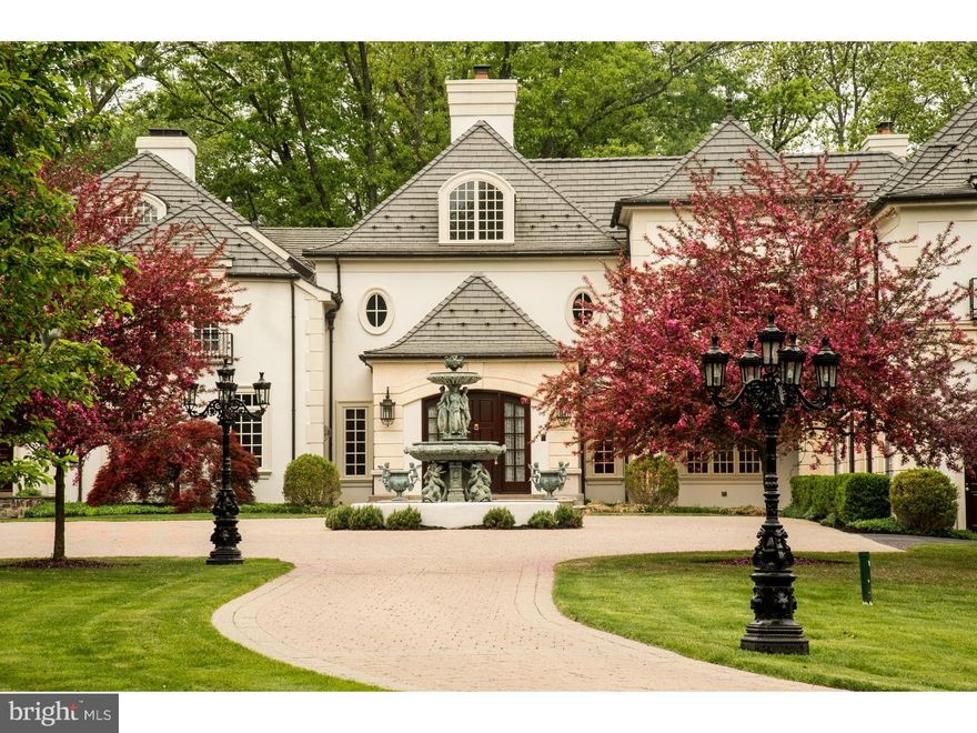 Exquisite French Manor Home sitting in prestigious location on 5 tranquil ac. Original home built in 1936 was totally restored & integrated into newly constructed existing residence in 2002 & enlarged to over 10,000 sqft. Sitting behind privacy wall, main driveway has 2 gated entrances, is lined w/French St lights & centers on beautiful central paved courtyd w/antique fountain. Entrance foyer leads to lg & impressive Grand Hall w/its stone FP, sweeping staircase & impressive decor. Impressive LR adjoins terrace & formal DR w/breathtaking mldgs & trim. The exquisite FR is the heart of the hm & has beautiful mldgs & bkcases along w/a warm FP. The perfect gathering place,the Kit,new large sunny Brkfst Rm, Butlers Pantry, Laund/Mud Rm & back staircase are all part of "old house" along w/the comfortable Den & warm Study. This sec has the charm of yesteryear with the convenience of today. The wrap around flagstone walled terrace provides sophisticated spots for lavish entertaining or just for quiet evenings at home. This is a once in a lifetime opportunity - a truly stunning home.  Be sure to view new video which includes new  delightful sunny breakfast room.