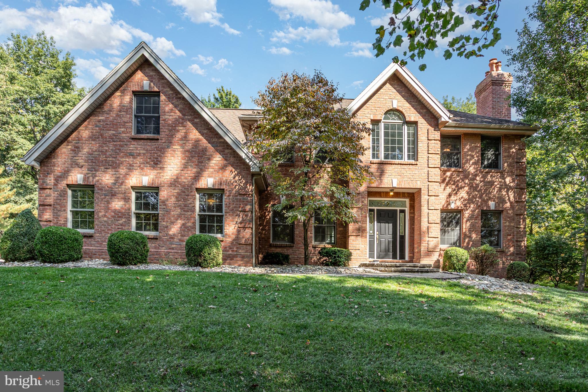 Looking for peace, privacy and tranquility? Your search is over! This location is a rare find. Welcome to 6 Glencarron Ct, tucked away on a quiet cul-de-sac. This stately all brick, 2 story home sits on a secluded 2.17 acres surrounded by mature trees! When you drive up the custom paver driveway featuring inlaid medallion accents, you will feel right at home. This impressive home has been meticulously maintained and loved for 25 years by its original owners. All major systems have been gone over and professionally serviced prior to listing. Move in with confidence and begin making this beautiful home your own. Over 4,000 sq. ft and freshly painted from top to bottom! Enter into the grand two-story foyer with turned staircase as you pass by a private front office. To the right is a formal sitting room with wood burning, brick fireplace and large dining room perfect for all those family holidays. Relax by the gas fireplace in the cozy family room, open to the large eat in kitchen overlooking the expansive paver patio with outdoor fireplace. Just in time to enjoy the beautiful fall evenings gathered around. Double doors lead to the master retreat with en-suite bath featuring jacuzzi tub. His and her walk-in closets! Off the master bath, is a nicely sized room previously used as a nursery but would be perfect for a private office, sitting room or additional walk-in closet. Three other generously sized bedrooms, another full bath and second floor laundry complete this level. All rooms have brand new, neutral carpet. Still need more space? Check out the partially finished walk out basement, which includes a full bath. You will enjoy watching all the wildlife in your 2+acre yard. Don't miss out on this rare opportunity! Tons of memories to be made here!