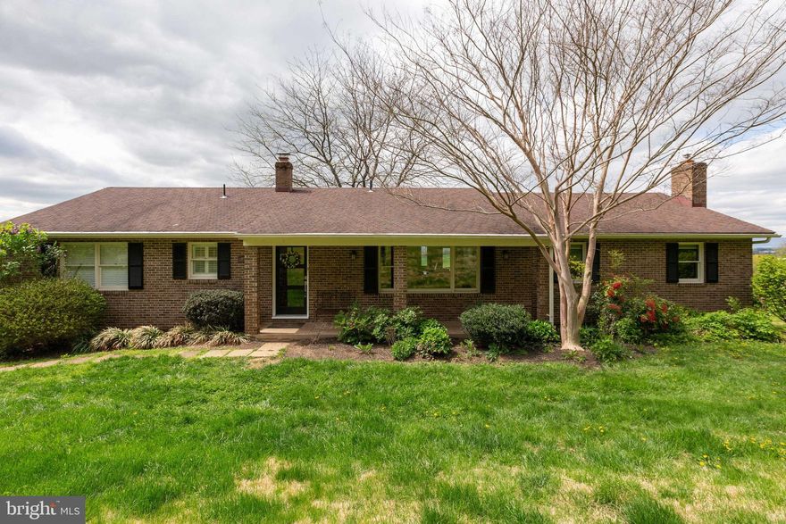 Absolutely stunning 4 bedroom and 3.5 bath rambler with a finished basement almost one acre of land with amazing views. The main level has two bedrooms and two full baths with an updated custom kitchen and hardwood floors. There is a living room, dining room an large family room with a fireplace. The deck off the dining area has stunning views on the main level. The basement has two additional bedrooms and one full bath with a rec room and walkout to the backyard and garage area. This home is a must see and ready to move in.