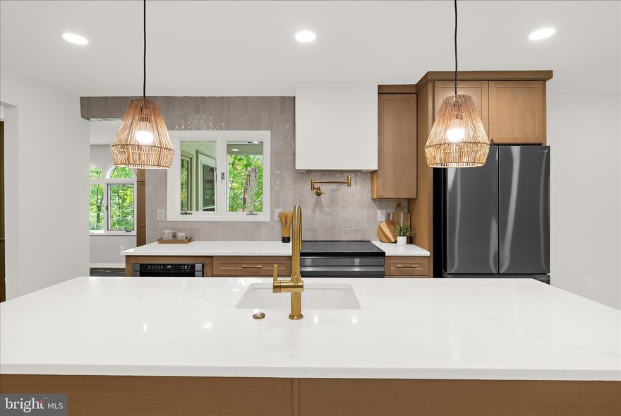 Welcome to 1196 Tanager Drive in Millersville—where thoughtful design, modern updates, and peaceful surroundings come together to create a truly special home. This beautifully renovated rancher offers the perfect blend of style, comfort, and flexibility, making it ideal for today’s lifestyle.
Step inside to discover a bright, open-concept main level with three bedrooms and two fully renovated bathrooms, including a spacious primary suite complete with a custom walk-in closet and private bath. The heart of the home is the stunning, fully redesigned kitchen, featuring a large island, quartz countertops, soft-close cabinetry with dovetail drawers, a farmhouse fireclay sink, modern range hood, pot filler, stylish tile backsplash, and brand-new stainless steel appliances. Just off the kitchen, the dining area includes a sophisticated dry bar with soapstone counters—perfect for entertaining—while the walk-in pantry/mudroom provide exceptional storage and everyday convenience with durable tile flooring.
The finished lower level dramatically expands your living space, offering a large recreation room perfect for movie nights, game days, or gatherings. With the potential for a fourth bedroom, a third beautifully renovated bathroom with a frameless glass shower, a large utility/workshop area, and an additional flexible room for an office, gym, hobby space, or storage, the basement provides endless possibilities.
Throughout the home you’ll find thoughtful upgrades including new luxury vinyl plank flooring on the main level, brand-new carpet in the basement, and three fully renovated bathrooms with modern tile, vanities, lighting, and fixtures. The electrical system has been updated along with new recessed lighting, outlets, switches, and fixtures throughout the home, plus new exterior lighting, new interior doors, new railings and balusters leading to the basement which also includes a laundry area with washer, dryer, and new utility sink adding even more convenience. The list goes on!
Outside, enjoy updated landscaping and easy backyard access from both levels, multiple patio areas perfect for relaxing or entertaining, surrounded by mature trees and scenic farmland, the setting feels quiet, private, and wonderfully rural—yet you’re just minutes from everyday conveniences like route 3 and the Waugh Chapel Shopping center. 
Additional major improvements include a roof less than five years old with a gutter guard system, updated the rear retaining wall, freshly painted interior and exterior, an updated septic system with new dry well and exterior pipe replacement, and a transferable leased water treatment system. The well was replaced in 1997, adding to the home's solid infrastructure.
Ideally located near NSA Fort Meade and just 15–20 minutes from Annapolis, with convenient access to Routes 97 and 32, this home is perfectly positioned between Baltimore and Washington, D.C. You can also enjoy The South Shore walking/biking trail just around the corner. 
If you’ve been looking for a move-in-ready home with high-end finishes, flexible living space, and a peaceful setting—this is one you won’t want to miss. 
Open Houses on Saturday 5/2 and Sunday 5/3!!
