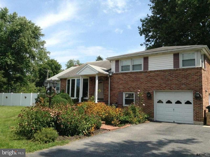 Spacious 4BR, 2BA Split level in convenient location. Bring your contractor estimates for any repairs.  Great layout with open Floor Plan, additional Family Room with Stone Fireplace, French Doors lead out to patio with large fenced-in yard.  Garage with additional parking spaces and 2 sheds for plenty of storage.