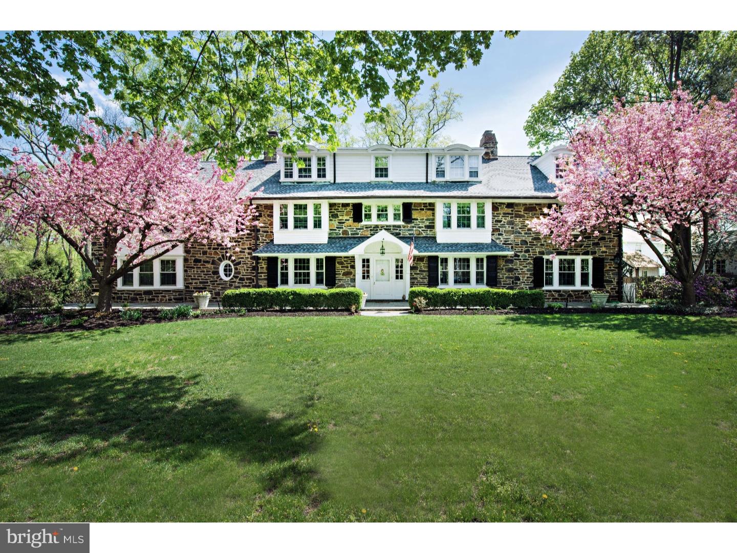True Main Line Estate featuring a stately stone Manse accompanied by Pool, Detached Garage with Pool House, Tennis Court, Beautiful Lawns and Exquisite Landscaping. Located in a well-established North-side neighborhood, this jewel of a property is within a short walk of Suburban Square boutique shopping and SEPTA regional rail. The home itself is glorious, with spacious and well-appointed rooms, perfect for formal entertaining but with a floor plan ideal for everyday family living. Impressive interior features include magnificent millwork, sweeping front stairs, beautiful built-ins, old world pocket doors, and 6 unique fireplaces. The main level offers a grand entry Foyer, formal Living Room, banquet size formal Dining Room and a handsome Library. The spacious Family Room adjoins the Kitchen comprised of Chef's area, sunny Breakfast Room, Butler's pantry with additional dishwasher and refrigerator, and oversized pantry room, 2 powder rooms and a mudroom. Enjoy the grounds from the covered stone terrace or the sunny back deck off the kitchen. Upstairs find a private master suite with sitting room with built-ins, spacious Bedroom, his and her updated baths and dressing rooms, numerous closets, and built-ins. 4 additional bedrooms, 3 full baths, oversized laundry room with linen storage and more complete this level. The third floor offers additional space for guests, au pair, office, playroom or fitness. The exterior and major systems have been impeccably maintained and updated. The pool and pool house are a lovely, private retreat, the tennis court and additional property are in 'as is' condition with any number of possible uses. This is a delightful property unparalleled in location, amenities, condition and price. Call for your private showing.