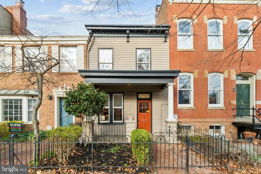 Located just one block to Eastern Market in one of the most coveted locations on Capitol Hill. This porch fronted row has a fully fenced low maintenance front yard. Enter the East facing front door into the living room with cornered wood burning fireplace, separate dining room, and past the guest powder room to the updated kitchen with white quartz counters, induction range, full suite of stainless appliances, and ample storage. Walk out to your recently installed, stamped concrete patio perfect for lounging or grilling. The rear brick shed is great for gardening and your bicycles. The second floor landing includes a large dual vanity bath with a tub and stacked laundry in the hall, which is bookended by two large bedrooms. The rear west facing primary suite has two, double door closets. The front East facing bedroom is great for guests or as a home office! Proximity to everything the Hill has to offer including Barracks Row, 2.5 blocks to Trader Joe's, 6 blocks to Whole Foods and just a few blocks further to the SE Waterfront and Nationals Stadium. Green space just three blocks away at Folger Park or Marion Park.