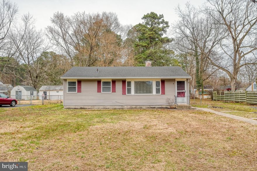 Adorable 3BR/1BA Rancher located on a sprawling lot in a quiet neighborhood.  Step into a cozy, welcoming home featuring original hardwood floors throughout.  The spacious living room boasts tons of natural light from the large front window.  Off the living room is a full bath and three spacious bedrooms, one featuring built-in shelving.  The kitchen offers plenty of solid wood cabinets and a double sink under a window that looks out onto an amazingly sized yard.  Conveniently located off the kitchen is laundry and storage.  From the kitchen, step out onto a spacious wood deck with steps to a platform deck.  From here, you’ll overlook tons of green space in the fenced yard and a shed for extra storage.  An ideal home for any new homeowner, it is located within close proximity to shopping, restaurants, and commuter routes.