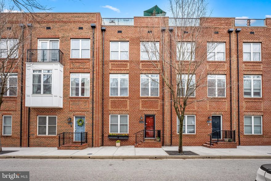 Excellent McHenry Point offering! Lower level boasts, laundry room, powder room , study or optional 4th bedroom, 2 car garage. Second floor with wood floors, kitchen adjoins family room, elegant dining room, spacious living room. Third level boasts 3 bedrooms, new carpeting , primary and hall bath . Third floor with wet bar and mini fridge, spacious roof top deck with panoramic city views of harbor and surrounds.  Furnace January 2023, AC replacement August 2024. Feel the energy of the neighborhood and watch 4th of July fireworks from your deck! Enjoy!!