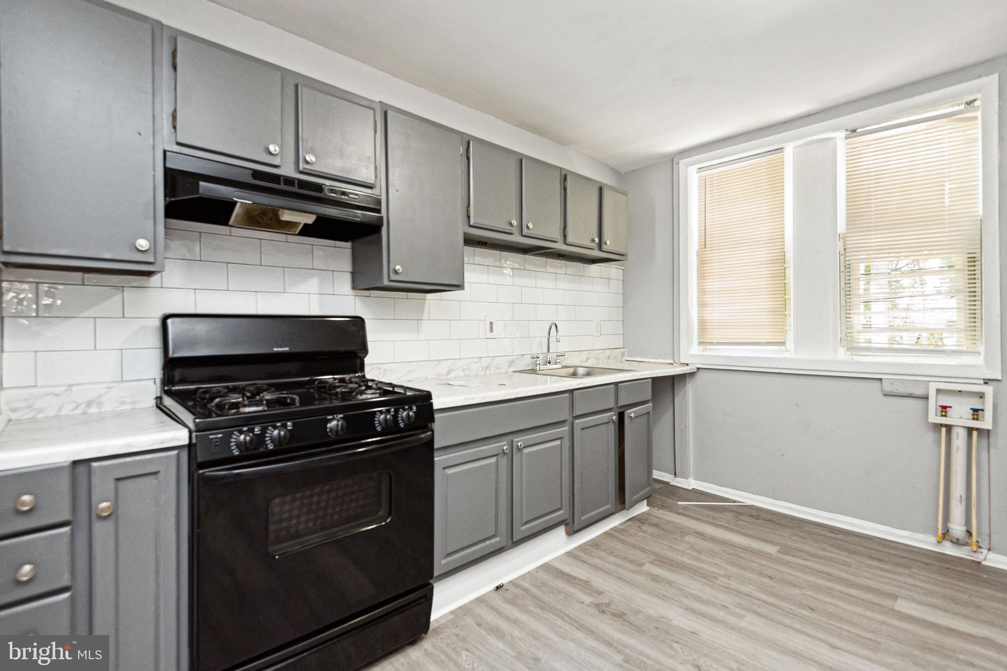 3 Bed 1 Bath Completely renovated from top to bottom which includes installation of brand-new roof!!! This gem not only has exposed brick but also a stunning and newly installed bathroom and kitchen. If that wasn't enough home has also been freshly painted with NEW carpet installed throughout. Home is being sold As Is, but Owner has prepared it nicely to market. COMPLETE TURNKEY PROPERTY. Recent kitchen upgrades include cabinets and flooring. Appliances are conveying in working order and As Is condition washer/dryer hook-ups already installed. Fenced rear yard. Gas heat. Street parking. HUGE Rental Opportunity $$$$$. Affordable $$$$. Run the numbers and YOU will see for yourself the ROI percentage is VERY advantageous. Call Song Hong for a grant for up to 70k.