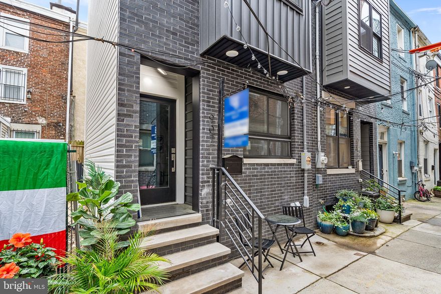 Brand New Construction in the heart of Bella Vista and the Italian Market, located on a private street, with a 10 Year Tax Abatement*. This 2 Bedroom, 2.5 Bathroom beauty was built with attention to detail. Wide plank hardwood flooring is throughout. On the first floor you will find a modern white, flat panel kitchen with quartz countertops that continue up the backsplash and stainless steel appliances. The 2nd Floor you will find an ensuite bedroom with it’s own private bathroom, complete with a porcelain tiled bathroom and matte black fixtures. The 3rd Floor is also another ensuite bedroom with another private bathroom with matte black fixtures. A spiral staircase continues up onto the roof deck that provides incredible views of the city. Downstairs is a fully finished basement with laundry, living space and a powder room for convenience. With a WalkScore of 98, 907 S Schell St is located in a Walker’s Paradise, just steps away from some of the neighborhoods best amenities, including; DiBruno’s, Claudio, Anthony’s Coffee House, Villa DiRoma, Paffutto, Angelo’s Pizzeria, Alice and many more.