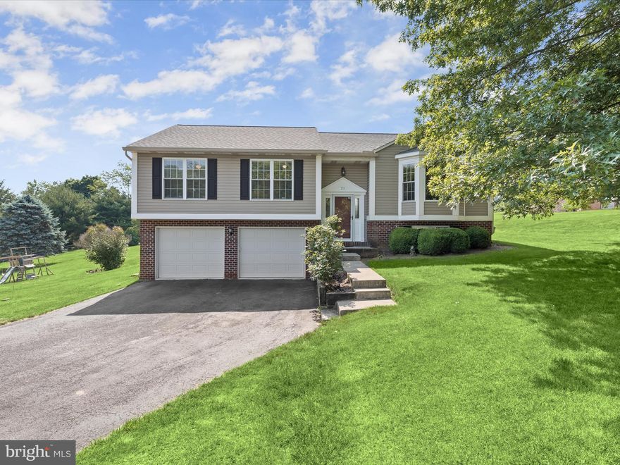 Welcome to this split-foyer colonial in the Glen Rock community of York County. This home boasts beautifully landscaped grounds and an inviting open floor plan on the main level. Features include luxury vinyl plank flooring, a vaulted ceiling, and a bay window that fills the space with natural light. The dining area leads to a three-seasons sunroom, offering stunning views of mature trees and the serene property. The kitchen is a chef's dream with a double sink, large windows, ample storage, a vaulted ceiling, a pantry, and stainless steel appliances.  The primary bedroom suite is a retreat with plush carpet, a double vanity, a walk-in shower, a soaking tub, and a walk-in closet. Three additional bedrooms feature a mix of carpet and laminate flooring, ceiling fans, and custom blinds, along with a hall bath.  The lower level includes a bright and spacious family room with ample storage and carpeting, plus access to the two-car garage, perfect for family gatherings and relaxation. This home is a must-see!  Major commuter routes include PA-74, PA-30, and I-83.
