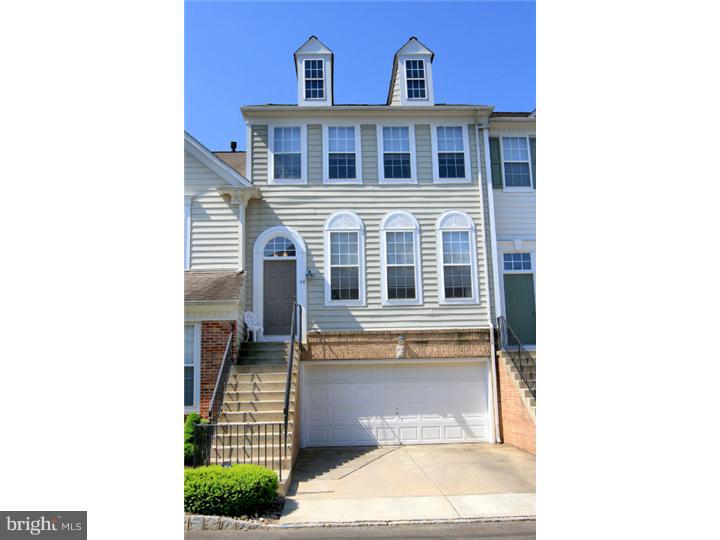 Premium location in Doylestown Station, backing up to green and woods. This lovely CB West townhouse with only 3 easy steps to the lower level from your garage provides the ease of condo ownership, ample square footage and modern amenities. Full kitchen with new gas range/oven and microwave, full and bright breakfast room, and country-style sink in the island surrounding by plenty of prep and storage space. The cozy great room flows in the open plan from the kitchen and enjoys a gas fireplace. The bright deck overlooks the woods and is ready for three seasons of afternoon sunsets. The master suite has a walk in closet, and an en suite full bath with soaking tub. Bedroom level laundry is adjacent to all three bedrooms. Attached 2 car garage plus driveway parking, finished walk-out lower level with half bath and opportunity for a patio area. New central air condensers and high efficiency natural gas heat/water. Convenient to the new 202 Parkway, 611, downtown Doylestown Borough.