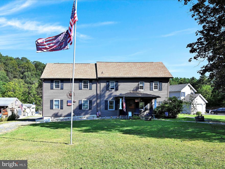 Welcome to a truly one-of-a-kind 5.5-acre property that offers the perfect blend of rustic charm, natural beauty, and everyday comfort. At the heart of the property sits a historic old farmhouse, rich with character and original details, including wide-plank wood floors, exposed beams, and rooms that still showcase their original log home interiors. Thoughtfully expanded over the years, the home now includes a massive open-concept living and dining area that flows seamlessly to a large rear deck with a pergola — an ideal space for entertaining or simply enjoying the peaceful surroundings. New roof with transferrable warranty. The kitchen is well-equipped with a center island and opens to a cozy covered patio featuring a porch swing — a perfect spot for morning coffee or evening sunsets. A laundry room and half bath are conveniently located just off the kitchen, along with a main-level bedroom that includes a closet but could be opened back up to restore the home's original layout.

Upstairs, you’ll find four generously sized bedrooms. Two remain true to the home's historic roots, with exposed beams and vintage charm, while the other two reflect the updates and newer construction of the addition. Additional foyer areas on both levels provide the perfect opportunity for small office spaces or reading nooks, offering versatility throughout the home.

Outside, the land is a rare find — combining large open pastures, gently wooded areas, and a scenic stream that winds along the back of the property. It's ideal for those seeking space to relax, garden, or raise animals. For equestrian enthusiasts, there are horse stalls already in place. The fenced-in garden area is ready for your next harvest, while multiple outdoor features — including an above-ground pool, fire pit area, two decks, and a carport — add to the lifestyle appeal. Two sheds sit on the property: one fully finished and currently used to display handcrafted wood items, and another for general storage.
Whether you're dreaming of a quiet country escape, a small hobby farm, or a place to create, this property offers a rare opportunity to enjoy the best of both worlds — historic charm and modern living in a serene, private setting.
This home is being sold as-is, with select furniture remaining and other items available for purchase. Contingent on seller finding new home.