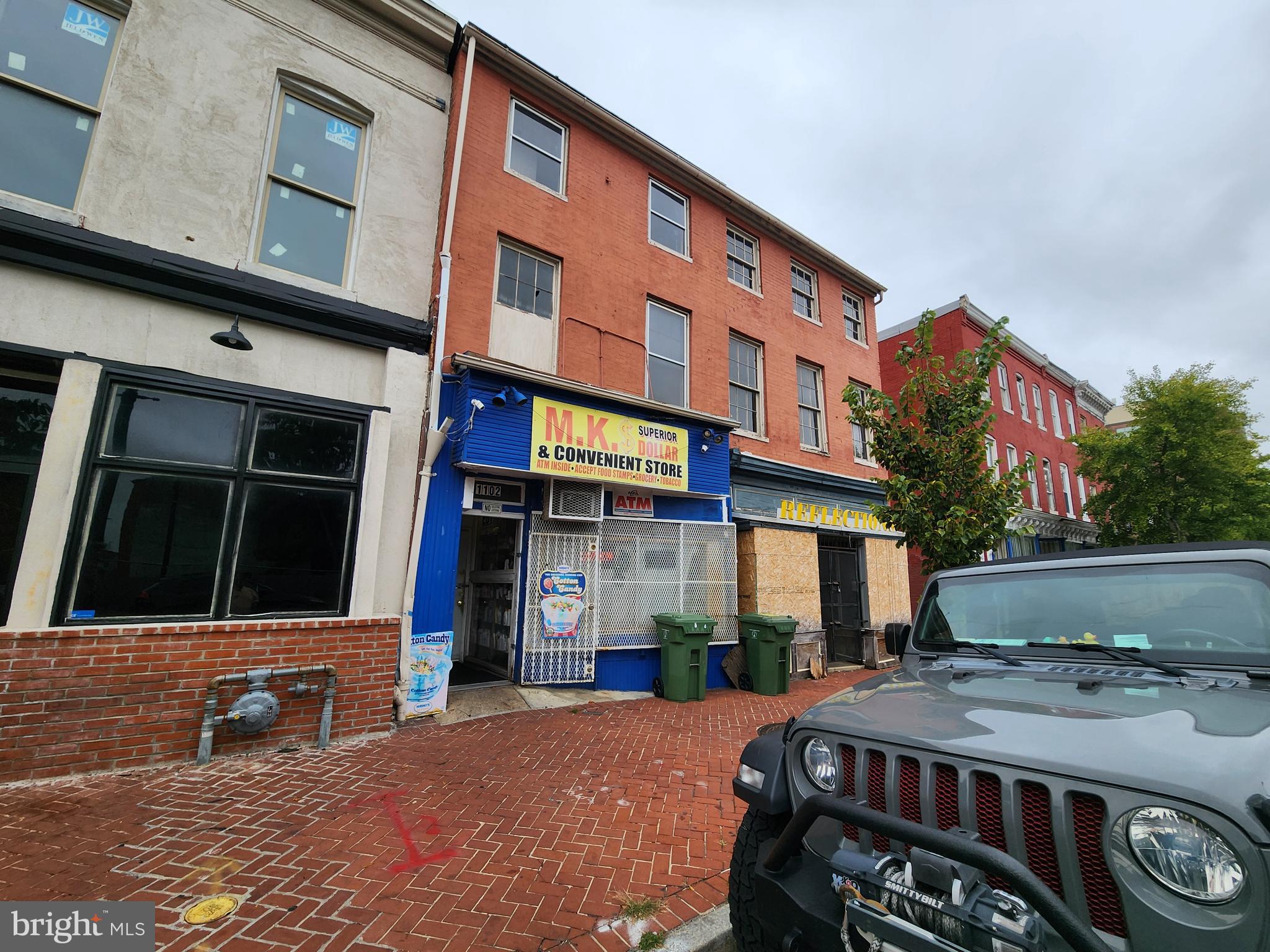 ONLINE AUCTION: Bidding begins 09/24/2025 @ 10:00 AM. Bidding ends 09/26/2025 @ 11:20 AM. List Price is Suggested Opening Bid. Deposit: $10,000.
This three-story mixed-use commercial and residential property is located in the Poppleton neighborhood of West Baltimore. Nearby attractions and establishments include Carroll Park, the University of Maryland Baltimore, and the University of Maryland Medical Center. For shopping and retail needs, the property offers convenient access to Hollins Market, Lexington Market, and Mount Clare Junction Shopping Center. An exciting highlight for the neighborhood is the upcoming La Cité Development in Poppleton. The property also benefits from its proximity to major roads such as Martin Luther King Jr. Boulevard, Lombard Street, and Howard Street, providing direct routes to downtown and beyond. Currently, the property is partially rented, with a commercial corner store occupying the main level, while the upper-level apartment is vacant and in need of significant renovation.