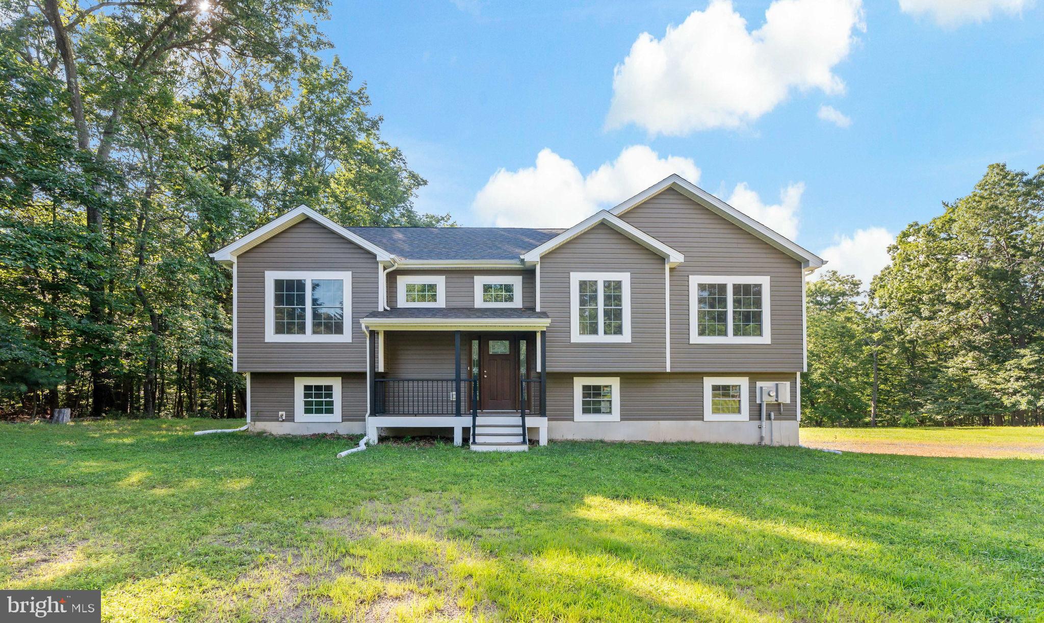 Brand new construction on 1.84 picturesque acres! This beautifully designed 3-bedroom, 2-bath home offers 1,550 finished sq. ft of modern living space, with an additional 700 sq. ft of unfinished basement ready for your personal touch. Enjoy the open floor plan, a fully equipped kitchen, and a rear deck perfect for relaxing or entertaining. The property includes both a 2-car attached garage and a 1.5-car detached garage—ideal for extra storage, hobbies, or a workshop.
Situated on a level lot with a gentle rear slope, the property features a small pond and is within walking distance to a serene community lake—perfect for swimming and kayaking. Outdoor enthusiasts will love being just minutes from Sleepy Creek State Forest, offering over 32,000 acres of hiking, hunting, and adventure. This is the perfect blend of peaceful country living with modern comforts!
