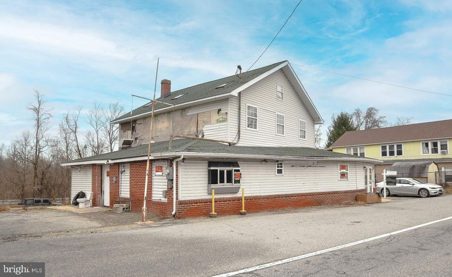 Two story Tavern/Restaurant with approximately 600 sq. ft. deck on back on 23,723 SF of land with approximately 25 parking spaces. Tenant has full liquor license with on/off premises sales, keno, drive up window. Major renovation in 1998 included updating windows, insulation, wiring, roof and septic. Renovation was started but not completed therefor this property is being sold as-is at an objectively reduced price.
