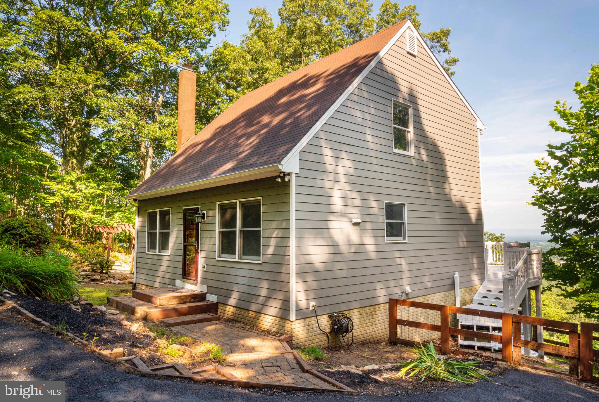 Welcome to 487 Applewood Dr, a beautifully maintained home nestled in the scenic Apple Mountain Lake community of Front Royal, VA. This charming property offers the perfect blend of privacy, comfort, and convenience — just minutes from I-66 and only a short drive to downtown Front Royal, hiking trails, Shenandoah National Park, and local wineries.
This 4BR/3BA home with over 2100 square feet of finished living space can become your on private getaway to the mountains! Enjoy beautiful year-round views from multiple decks, cozy evenings around the fire pit, or the quiet setting with mature trees and beautiful landscaping - all accessible by paved roads!
Step inside to find a warm and inviting interior. The main floor features an open living room and kitchen design along with a bedroom/office and bathroom. New granite countertops and backsplash complete the look of this large eat-in kitchen. The upper level has 2 bedrooms and a loft, as well as a full bath. The lower level has a large family room with a wood-burning stove, and an additional bedroom and bath.
This lovely home is move-in ready and ideal for full-time living or weekend getaways. Schedule your showing today!