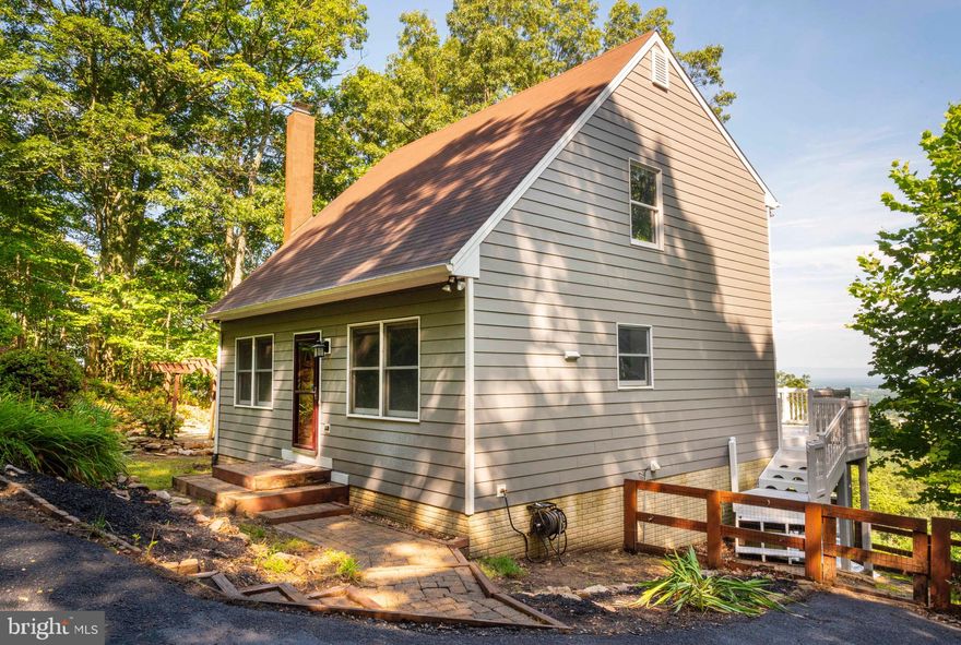 Welcome to 487 Applewood Dr, a beautifully maintained home nestled in the scenic Apple Mountain Lake community of Front Royal, VA. This charming property offers the perfect blend of privacy, comfort, and convenience — just minutes from I-66 and only a short drive to downtown Front Royal, hiking trails, Shenandoah National Park, and local wineries.

This 4BR/3BA home with over 2100 square feet of finished living space can become your on private getaway to the mountains!  Enjoy beautiful year-round views from multiple decks, cozy evenings around the fire pit, or the quiet setting with mature trees and beautiful landscaping - all accessible by paved roads!

Step inside to find a warm and inviting interior. The main floor features an open living room and kitchen design along with a bedroom/office and bathroom.  New granite countertops and backsplash complete the look of this large eat-in kitchen.  The upper level has 2 bedrooms and  a loft, as well as a full bath.  The lower level has a large family room with a wood-burning stove, and an additional bedroom and bath.  

This lovely home is move-in ready and ideal for full-time living or weekend getaways. Schedule your showing today!