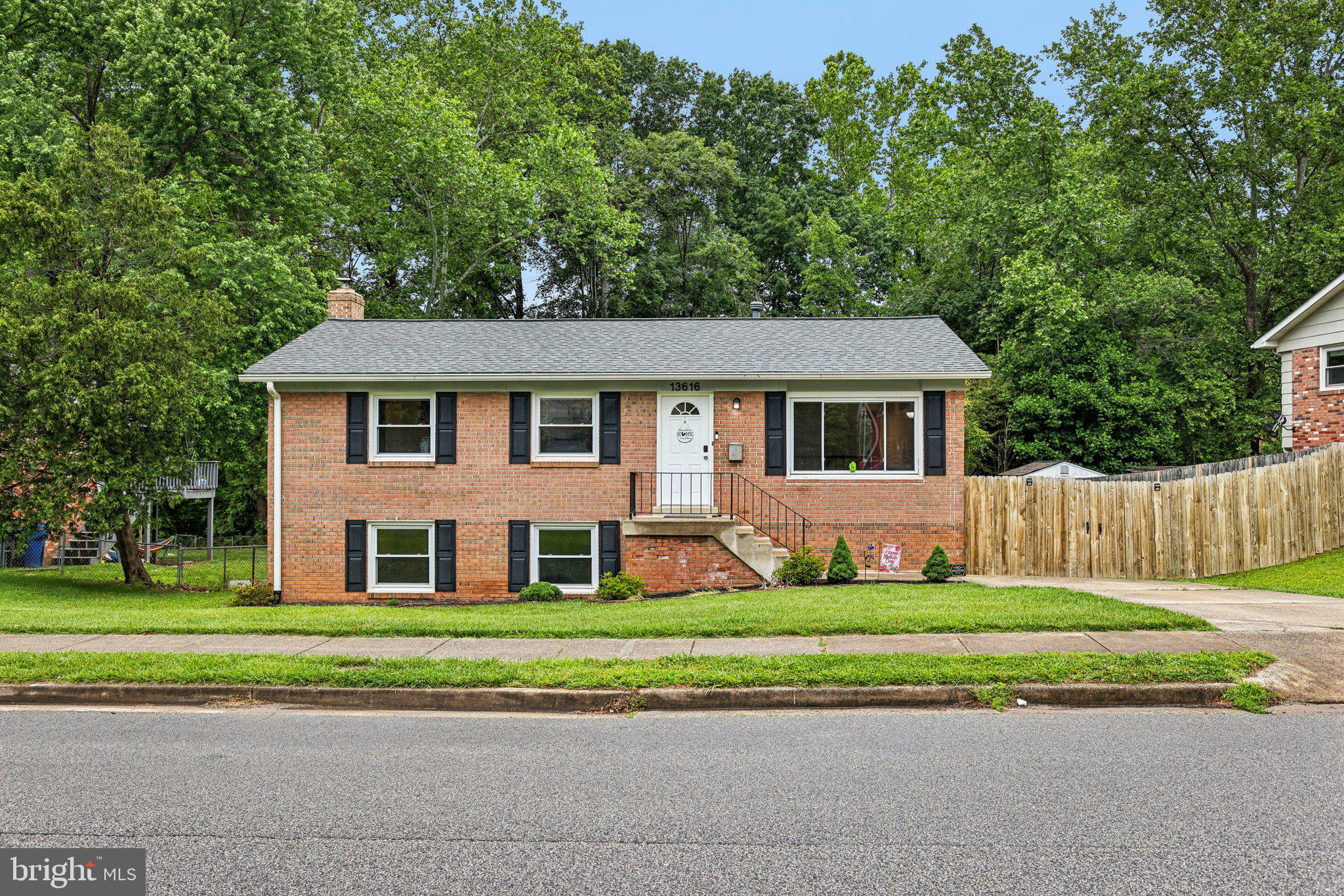Welcome to 13616 Kerrydale Road, a beautifully maintained 5-bedroom, 2.5-bath raised rambler offering over 2,000 square feet of finished living space on a private, tree-lined lot in the established Kerrydale neighborhood of Dale City. With a flexible layout, recent system upgrades, and classic charm throughout, this inviting home delivers the perfect combination of comfort, functionality, and location.
The home’s three-sides brick exterior not only enhances its timeless curb appeal but also offers lasting durability and low-maintenance convenience.
The main level welcomes you with warm hardwood floors that run throughout the entire level, creating a cohesive and classic look. The kitchen features durable LVP flooring, ample cabinetry, and generous counter space—ideal for both everyday meals and entertaining. Also on this level are the primary bedroom with a private en-suite full bath and two additional bedrooms. A centrally located half bath is easily accessible to everyone on the main level.
Downstairs, the fully finished walkout lower level adds incredible versatility with a large rec room anchored by a cozy brick fireplace, two more spacious bedrooms, and a second full bath—perfect for guests, multi-generational living, or a dedicated work-from-home setup. Plush carpeting adds warmth and comfort throughout the lower level.
Step outside and fall in love with the backyard—private, tree-lined, and backing to woods. Whether you're hosting summer cookouts on the deck or relaxing while the kids play, the outdoor space truly shines. Best of all, the pool and playset convey with the home, so it’s ready for fun from day one.
Major systems have already been taken care of, including a newer roof, boiler, and water heater, all in 2019, plus updated windows within the last five years, giving you peace of mind and making this home move-in ready.
Ideally located just minutes from Potomac Mills, Stonebridge at Potomac Town Center, and local favorites like Andrew Leitch Park, Waterworks Water Park, and Leesylvania State Park. Commuters will love the easy access to I-95, Prince William Parkway, and nearby VRE stations for stress-free travel to D.C. and beyond.
This is the one you’ve been waiting for—full of charm, space, and ready to welcome you home. Don’t miss your chance to own this exceptional property in a well-established Woodbridge community.