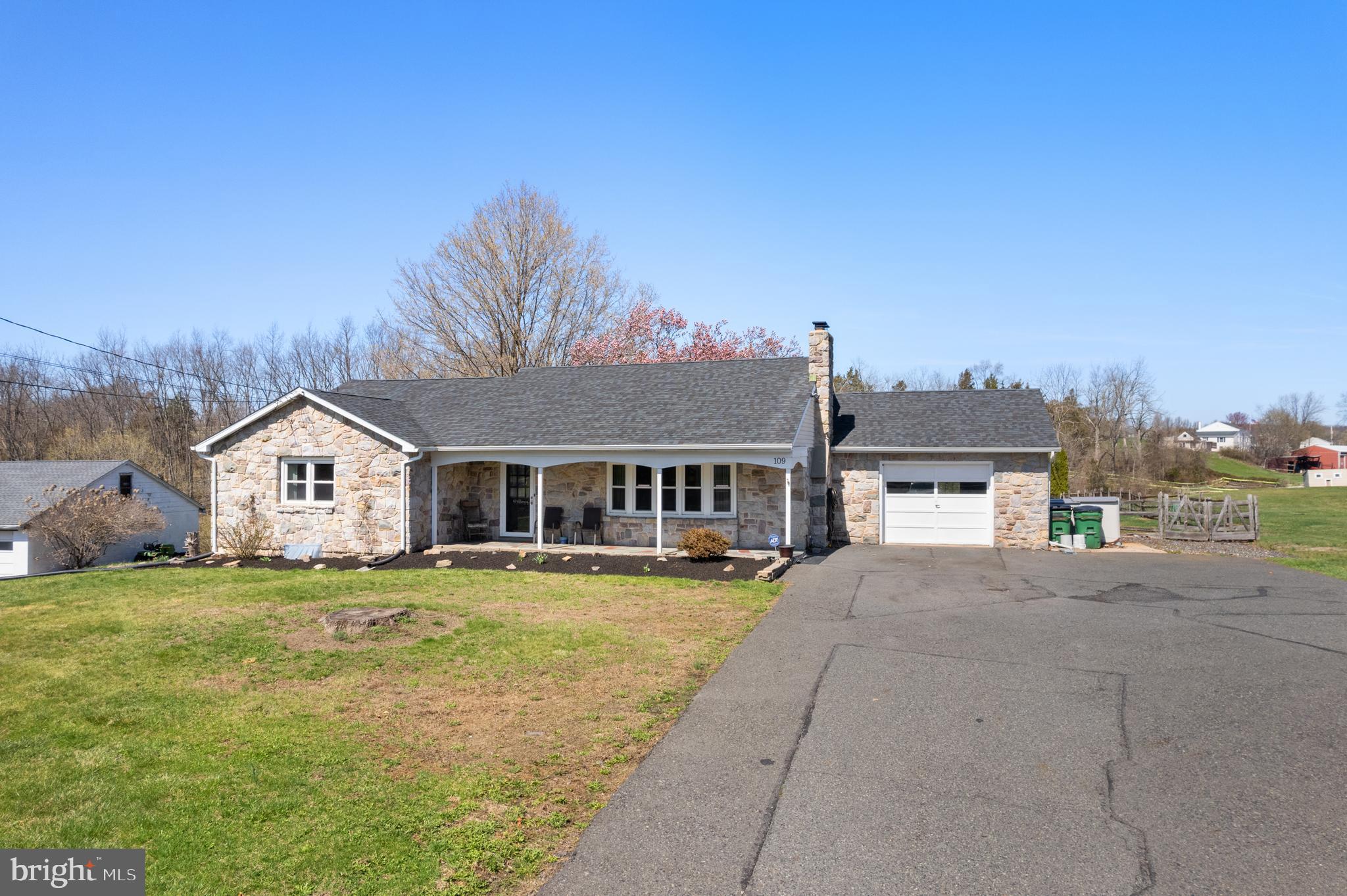 Are you looking for one floor living? You may have just found it! This spacious stone front ranch home is situated on almost an acre of ground with a large fenced rear yard.
You'll enter the home through the foyer and immediately feel the warmth and character. The living room features hardwood floors, stone fireplace with surrounding shelves, and an amazing picture window that adds natural lighting to the space.
Directly behind the living room is the large country kitchen which features an abundance of cabinets, Corian counter tops, stainless steel appliances, and the focal point is a reclaimed barnboard center island.
Adjacent to the kitchen is the dining room that is perfect for your formal sit down meals. There is a sliding door that gives access to the rear covered porch and concrete patio as well as the spacious rear yard.
The remainder of the first floor features two ample size bedrooms and a recently remodeled full bath.
The second floor of the home was finished into one large bedroom with an adjoining storage area or a walk-in closet. This space would make a possible master bedroom suite or a private bedroom for the older children .
The entire family will fall in love with the full finished basement. There are three separate rooms that are currently used as recreation /movie room, exercise room, and play room for the kids. Additionally, a half bath was added for total convenience and comfort. In the back of the basement is a large storage/workshop area with an outside entrance leading to the rear yard. The fenced rear yard is ideal for the kids and pets. Relax around the cozy fire pit and roast a few marshmallows and gaze at the stars.
This home is situated just minutes from the popular Skippack Village with it's shops and restaurants. It's only five minutes to Spring Mountain Ski Area and the popular Perkiomen walking /bike trail, as well as the Upper Perkiomen Park system with hiking and fishing galore.
It's an easy walk to the Wawa, Dunkin, CVS, Rita's Water Ice, barber shop and more.
Hurry out and make this home yours for the summer.