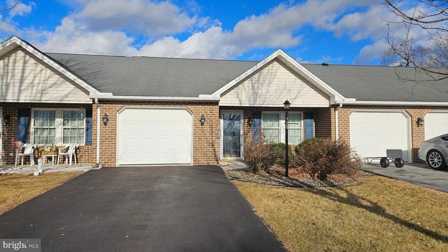 LOW MAINTENANCE LIVING... in this lovely, interior 2 bedroom, 2 bath townhome in Thornwood Village!  Spacious kitchen features pretty oak cabinets and updated flooring.   All appliances stay!  Heat Pump was replaced in 2022.  You will love the open floorplan!  Walk in shower in primary bath.   All on one level and HOA for exterior maintenance includes lawn mowing, snow removal and roof replacement! Low Utility cost, too!  (average electric is $75 per month)
The electric fireplace is not included.