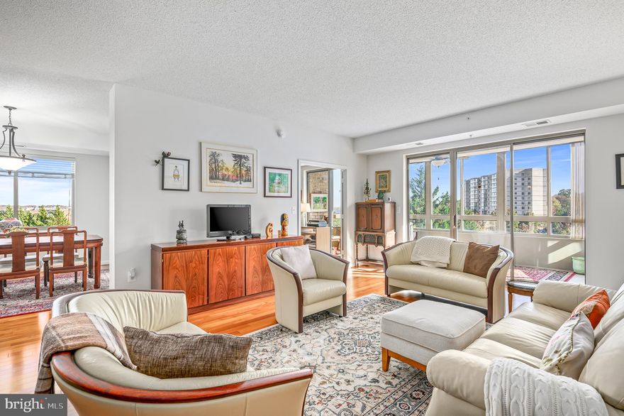 Welcome to this rarely available end unit in the highly sought after 55+ community of Lansdowne Woods! This 3 bed/2.5 bath unit flows like a dream with a large entryway/foyer greeting you upon arrival with plenty of  room for a table to drop off keys, a convenient spacious coat closet AND a powder bath. As you step into the living area, you will immediately notice the beautiful hardwood floors which are throughout the unit. The arrangement of your living room furniture is endless in this great space filled with light!  A study or 3rd bedroom is next to your living room along with the a tiled sunroom ready for you to relax and enjoy the view.  Plenty of cabinets and cooking prep space available in this gourmet kitchen featuring tile flooring, stainless steel appliances and granite countertops. A breakfast area and a wall of windows leads you into the formal dining room providing more space for dining/entertaining. A laundry closet in the hallway has storage/shelving for all your cleaning/laundry needs. The owner's suite features a large bedroom, walk-in closet, sliding door closet and bath with separate tub and step-in shower. A spacious 2nd bedroom with hardwood floors and 2nd hall bath is located across the hallway from the bedroom. An indoor garage space conveys with the condo along with a storage unit. Don't miss ALL the amenities available in the incredible updated Lansdowne Woods Clubhouse with indoor pool, fitness center, ceramics room, art studio and MUCH more. Enjoy living in a resort style community with beautiful views, walking trails and more activities than you can imagine!